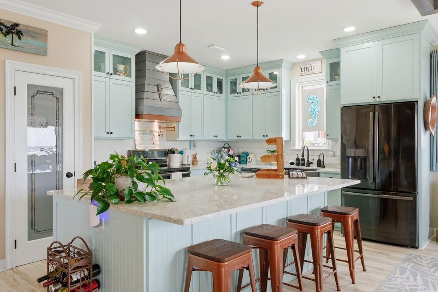 Welcome to Your Private Coastal Sanctuary in Caribbean Isle on Navarre Beach

From the moment you enter the exclusive, gated community of Caribbean Isle, you're transported into a true tropical paradise--complete with winding roads, vibrant coastal architecture, underground utilities, streetlights, and resort-style amenities including a community pool and tennis courts.

Perfectly positioned in one of the most desirable locations within the neighborhood, this custom-built, one-owner beach home offers the ultimate blend of privacy, convenience, and luxury. Just steps from your back door, you'll find direct access to the sugar-white sands and emerald waters of the beach. Enjoy peaceful morning strolls along the quiet shoreline, or head just across the street to experience the energy of Gulf. Designed for Coastal Living & Entertaining

This thoughtfully designed residence features four spacious sleeping areas, including a custom bunk room with built-in beds and storage--perfect for hosting family and guests. Every inch of this home reflects intentional design and elevated coastal style.

The main living spaces are pouring with natural light, enhanced by expansive windows and three generous porches that capture both sunrise and sunset views. With water views from nearly every angle, the connection to the coast is felt throughout the home.

The chef's kitchen is a true showpiece, featuring ceiling-height light blue cabinetry, upgraded countertops, designer sconce lighting, and an open layout ideal for entertaining.

Exceptional Features Inside & Out

Impact-rated glass for enhanced durability and lower insurance costs

Luxury vinyl plank flooring with a soft driftwood finish

Custom cable railing on decks for unobstructed water views

Metal roof for long-term durability

Deep soaking tub and designer tile shower in the primary suite

Abundant storage throughout, including a space designed for a future elevator (plans available upon request)

Ground Level Coastal Retreat

The lower level offers an incredible flex space--ideal for a den, game room, or "man cave"--featuring a unique glass garage door that allows natural light to pour in while maintaining privacy. Just outside, a private outdoor shower provides the perfect spot to rinse off after a day at the beach. (This was not added into the upstairs square footage.) 

With over 1,600 square feet of garage space, there's ample room for multiple vehicles, golf carts, and all your beach and boating gear.

Outdoor Living at Its Finest

The professionally enhanced landscaping, complete with multiple palm trees, perfectly frames the home and enhances its tropical curb appeal. Every outdoor space invites relaxation, from breezy porches to shaded areas below.

Additional Highlights

Located in the gated community of Caribbean Isle

Low HOA: $485/quarter

Flood Insurance: ~$996/year

Homeowners Insurance: ~$3,700/year

Furniture negotiable with acceptable offer

This meticulously maintained home offers not just a residence, but a lifestyle--where every day feels like a vacation.

Experience the beauty, comfort, and luxury of Navarre Beach living in Caribbean Isle. Schedule your private showing today. The community has an annual Road Reserve of $300.00 in addition to annual HOA dues. Buyer to verify all information deemed important to buyer including but not limited to lot size, room measurements, etc. prior to closing