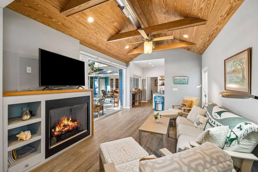 In the heart of Seagrove, just steps from the sand, local dining, shopping and the 30A bike path, this beautifully updated beach cottage offers the kind of easy coastal living that makes every day feel intentional. With deeded beach access and use easement granted to Gulf Shore Manor property owners, the four-bedroom, four-and-a-half-bath residence places the best of 30A close at hand while preserving a sense of privacy at home.
Inside, natural light fills the open-concept kitchen, living and dining areas, creating an inviting setting for everyday comfort, relaxed entertaining and time spent together after a day at the beach. Tile flooring extends throughout the first floor, where the spacious primary suite offers a quiet retreat with a remodeled spa-inspired bath featuring a walk-in shower, soaking tub and soapstone countertops. An additional first-floor bedroom and bath, with gas fireplace, enhances the home's flexibility for guests, extended family or multi-generational living.
The kitchen is both polished and practical with soapstone countertops, a Kohler sink, gas range and generous workspace designed for gathering. Outdoors, the private heated saltwater pool, expansive pool deck, separate hot tub and covered eat-up bar area create a resort-style setting made for slow mornings, sunny afternoons and casual evenings under the palms. A newly built outdoor shower, completed in 2025, adds another thoughtful touch for beach days. Beautiful landscaping, privacy shrubs, strong curb appeal and a paver circular driveway with additional side parking complete the setting, while a large outdoor storage shed offers ample room for bikes, beach gear and pool essentials. Additional features include a tankless water heater, abundant storage and a highly sought-after Seagrove address along Scenic Highway 30A. Never rented by the current owners, this inviting cottage is well-suited as a primary residence, second home, or vacation rental opportunity in one of 30A's most walkable coastal enclaves.