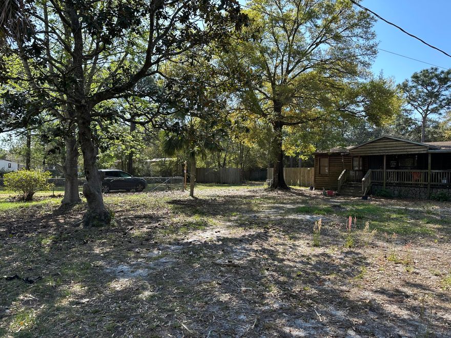ALMOST AN ENTIRE ACRE!  Great opportunity with plenty of potential! This property includes a mobile home currently on site that is being given no value, offering a blank slate for your plans. Also located on the property is a 24' x 22' detached building that could be finished out as a guest house, studio, workshop, or additional living space.
The property is filled with an abundance of beautiful plants and mature trees, creating a peaceful and established setting. 
Whether you're looking for an investment opportunity or a place to create your own private retreat, this property offers space, character. possibilities
