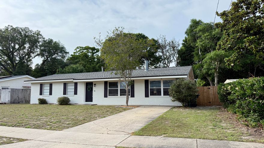 Located in desirable Yacht Club Estates & conveniently close to schools, parks, beaches, military bases, and shopping, this charming East Fort Walton Beach POOL home has been lovingly maintained and thoughtfully updated.  Offering 3 bedrooms, 2 baths, and a spacious indoor laundry room with pantry, the home features numerous upgrades within the past three years including copper rewiring, New Roof, New HVAC, new recessed lighting, updated kitchen with granite countertops and stainless appliances, renovated bathrooms, new vinyl windows in the living and dining areas, refreshed pool deck, saltwater conversion with new pool liner, and a new privacy fence. The inviting living room is nicely sized and anchored by a beautiful wood-burning fireplace.  The Formal Dining Room is multipurpose and measures 18x11!  The bright eat-in kitchen overlooks the backyard and in-ground pool, creating a perfect space for everyday living and entertaining. The primary suite is generously sized with a walk-in closet plus an additional closet, and a beautifully tiled walk-in shower. Two additional bedrooms are nicely sized, and all flooring is wood, tile, or vinyl--no carpet. The spacious backyard offers a private setting with a Large 16'x32' In-Ground Salt Water Pool and storage shed! This Move-In-Ready home is a standout opportunity with character, comfort, and modern updates throughout!