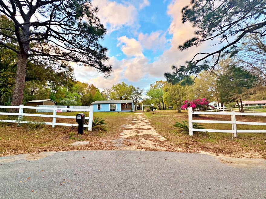 Welcome to this inviting 2-bedroom, 1-bath ranch on a private 1.00-acre lot in North Crestview. Features include a covered front patio, fenced in dog run, spacious living area, open dining/kitchen layout, and two well-sized bedrooms. Gracious storage shed directly behind the home. Roof and water heater was updated in 2020, flooring throughout was updated in 2023. Move in ready!