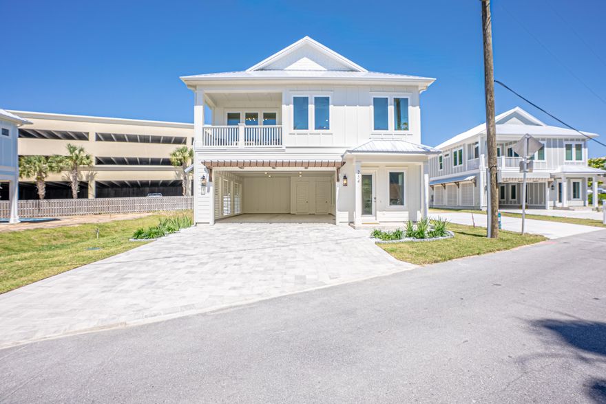 PRICE CUT BY $10,000 Home is now completed! Ready for Short-term Rental. New Construction Coastal Retreat - Fully Furnished. Discover this beautifully crafted coastal luxury home, located on the highly desirable West End of Panama City Beach--just steps from the Gulf's most beautiful beaches. Completed, fully furnished, and tastefully decorated, this residence offers both a serene retreat and exceptional income-producing potential. This 5-bedroom, 4.5-bathroom home spans two stories with parking for 6 vehicles and designed for both comfort and sophistication. The chef's kitchen is a true showpiece, featuring upgraded stainless steel appliances, including a French-door refrigerator, gas cooktop, dishwasher, wall oven/microwave combination, and washer/dryer. Custom 42'' white shaker cabinetry, quartz countertops, and a spacious walk-in pantry complete this gourmet space. The open design flows seamlessly to outdoor living with a 12'x24' private saltwater pool, gas-heated for year-round enjoyment. Additional highlights include: " Gas tankless water heater " Hurricane-impact rated windows " Durable metal roof & Hardie siding " 8' interior and exterior doors " 10' ceilings on both levels A spacious game room that offers views of the pool, while multiple living areas provide plenty of space for entertaining. Conveniently located within walking distance to the pristine white-sand beaches, and just minutes to 30A, Pier Park shopping, dining, entertainment, and a short ride to local grocery stores, this home is the perfect blend of luxury and convenience. Whether as a private coastal escape or a high-yield vacation rental, this home presents a rare opportunity on the beautiful West end.