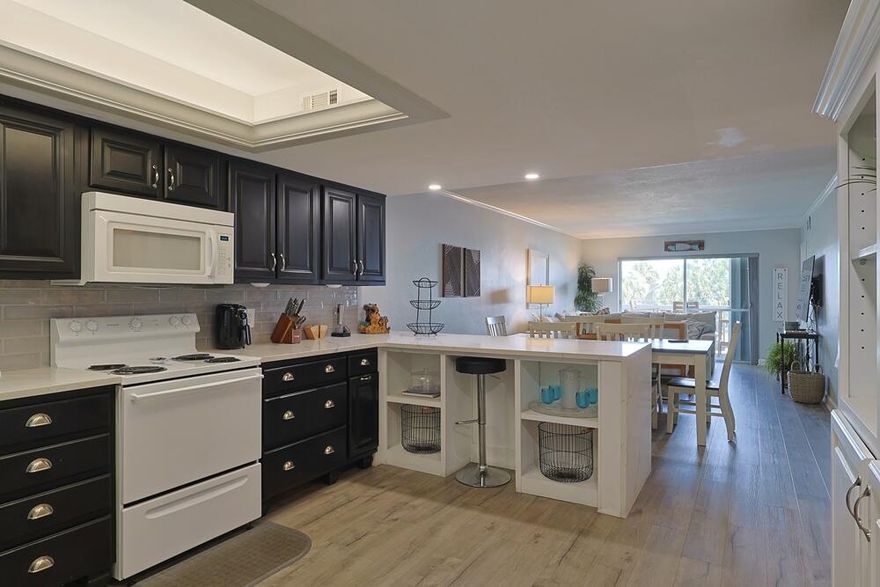 Beautifully updated and sold fully furnished, this turnkey condominium is rental-ready and ideal for immediate enjoyment or investment. The spacious layout features a modern remodel, with access to the private balcony from both the primary bedroom and living room. The balcony also includes a convenient storage closet.

Enjoy added peace of mind with hurricane-rated windows and doors, plus storm shutters. Located in the desirable El Matador community, this unit offers access to 12 acres of lush grounds bordering 17 miles of pristine, undeveloped beachfront.

Resort-style amenities include two swimming pools (one seasonally heated), a whirlpool spa, sauna, picnic area with grills, tennis courts, a fitness center, community room, and 24-hour gated security. Schedule your showing today! Improvement List
-2021 Original kitchen and foyer closet were removed to create an open concept kitchen.
-2021 New counter top, sink and bar to include waterfall end.
-2021 New flooring was installed throughout the entire unit.
-2023 New A/C air handler and compressor installed.
-2024 New front door installed.
-2024 New dishwasher and garbage disposal installed.