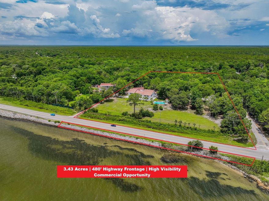 **Bayview COMMERCIAL / HOSPITALITY OPPORTUNITY | 3.43 Acres | 480' Highway  & Bay Frontage | Freeport, FL** Rare 3.43± acre BLUFF-TOP PROPERTY overlooking Choctawhatchee Bay with approximately 480 FEET OF FRONTAGE along State Road 20, offering exceptional property VISIBILITY AND SIGNAGE EXPOSURE on one of Walton County's fastest growing corridors.  With AADT traffic counts of approximately 11,400 vehicles per day, the property provides outstanding exposure for destination-based businesses, event venues, hospitality concepts, or live-work commercial operations.  Currently operating as a short-term rental and private event venue, the property demonstrates an existing revenue model while offering substantial opportunity for expansion or redevelopment. The site includes two substantial structures totaling approximately 9,000+ square feet:
" Main Building - 7,589 SF with multiple gathering areas, 
kitchens, and accommodatio suitable for hospitality or retreat use
" Guest Building - 1,426 SF with kitchen, living area, and additional lodging.

Positioned on an elevated bluff overlooking the Choctawhatchee Bay, the property features panoramic water views, expansive outdoor entertaining areas, a large pool, and more than 5,000 square feet of patio space.

The 3.43-acre parcel provides significant room for additional structures, parking expansion, or phased development, making it attractive for investors seeking to scale operations.

The property lies within Walton County's Rural Village future land use designation, which supports a mix of residential and neighborhood-scale commercial uses.

Potential uses include:

- Boutique Inn / Bed & Breakfast
- Wedding or Event Venue
- Corporate Retreat Center
- Wellness or Yoga Retreat
- Live-Work Business Campus
- Professional Office or Creative Campus

Neighborhood commercial uses such as bed and breakfast establishments, professional offices, and live/work concepts are permitted within this land use category.

Located approximately 15 minutes from Destin and the beaches, the property benefits from proximity to major tourism destinations while offering the space, privacy, and accessibility rarely found closer to the coast.

An exceptional opportunity for investors, hospitality operators, or entrepreneurs seeking a highly visible destination property with development potential.

Buyer to verify all information including zoning, allowable uses, measurements, and development potential.