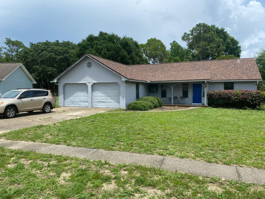 Your home awaits in this 3 bed / 2 bath with heated and cooled garage room / office / storage space!  Add a wall unit closet to the latter room and you could use it as a 4th bedroom. Recapture to 2nd car garage, if you want, and convert the other garage car space, but with HVAC!  New dimensional roof on 22 Feb, '22, by Holloway Roofing.  This home has new (Apr '26) laminate flooring in the great room, the mstr bedroom, two guest bedrooms, & the garage office that is vented for HVAC!  All bedrooms, living room, dining room, have been painted.  Sliding glass doors and tile in the kitchen and dining room were added years ago and are still in great shape!  Walker Circle allows you to live off the very busy John King Rd and much more of a neighborhood feel.  .  This home has a wonderful huge yard with privacy fence.  This home is conveniently south of I-10, so close to Duke, Eglin, and 7th Special Forces Group, but also close to South Crestview shopping.  Easy access to I-10 allows you to quickly go East to Tallahassee or West to Pensacola!  You are never far from the white sandy beaches of the Emerald Coast!  You are likely 30 - 40 mins, depending on when you start from your new home!  If going South to work, you can take John King to left on Live Oak Church Rd, or go past John King and on to Hwy 285, that gets more traffic in the mornings. Make your appointment, today, to see this awesome family home!  Cheers!