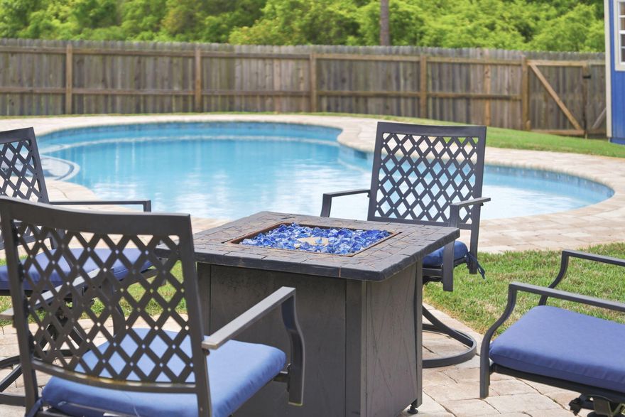 Welcome to your private retreat on Moonstone --where luxury, comfort, and smart living come together in one exceptional property. 

From the moment you arrive, the curb appeal sets the tone. Tucked into a quiet neighborhood with underground utilities and a true sense of community, this home offers both privacy and presence. Step inside and you're greeted with tall ceilings, expansive living spaces, and a thoughtfully designed open floor plan that was made for both everyday living and entertaining. This is one of the largest floor plans available, offering five spacious bedrooms, a dedicated office, and multiple dining areas including a breakfast nook and formal dining space. The kitchen is the heart of the home--featuring an oversized island, abundant cabinetry, and seamless flow into the main living area, all overlooking your outdoor oasis.

The primary suite is a true escape, complete with serene views of the backyard and private access to the patio--perfect for early mornings or quiet evenings by the pool.

Step outside and you'll understand what makes this property truly special. The brand-new gunite pool with tanning ledge creates a resort-style setting, while the .39-acre lot backs up to wooded privacy beyond the fence line. Enjoy breathtaking west-facing sunsets and peaceful evenings in your own backyard sanctuary.

And here's where this home truly sets itself apart...

This property features a Tesla Powerwall solar and battery system, essentially giving you your own private mini power plant. Designed for both luxury and peace of mind, this system stores energy and can power essential areas of the home during outages, high-demand periods, or after sunset. The home has a sufficient amount of solar panels for you. In Florida, where storms and outages are a reality, this is a major advantage--offering quiet, seamless backup power without the need for a traditional generator.

Beyond convenience, it also provides long-term energy savings and efficiency, making this a smart, future-forward investment. Systems like this are often valued in the $30,000-$50,000+ range, adding both immediate and long-term value to the home.

Located just an estimated 18-minute drive to Navarre Beach--while avoiding much of Highway 98--you'll enjoy the feeling of being in your own quiet town, with the same convenience as West Navarre but without the traffic.

This is more than just a home--it's a lifestyle upgrade.

Be sure to keep an eye out for upcoming open house dates and experience firsthand why this Moonstone property stands out as one of the most compelling opportunities on the market today.