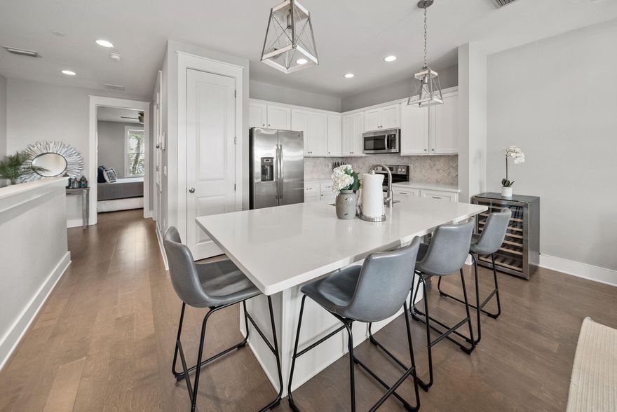 This beautifully appointed 3-bedroom, 3-bathroom townhome offers 1,624± sq ft of thoughtfully designed living space just steps from the sugar-white sands of the Emerald Coast. Perfectly situated in the heart of Seagrove Beach, this residence combines convenience and comfort with an unbeatable location, just a short stroll to pristine beaches, boutique shopping, local dining, and coastal amenities. Enjoy lazy afternoons by the community resort-style pool or hop on your golf cart (included!) and explore all that 30A has to offer. Inside, the open floor plan is bright and inviting, designed for both everyday living and effortless entertaining. The well-equipped kitchen flows seamlessly into the living and dining area. Clever built-in hallway bunk beds add versatility and extra sleeping space