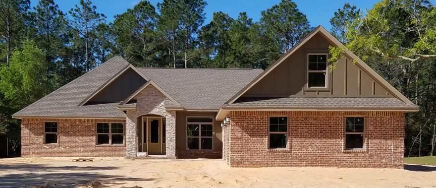 UNIQUE CUSTOM BUILT HOME in Hidden Creek Estates,Enjoying all the amenities including:Pools,Fully Equipped Gym,Tennis courts,Waterfront Park & Deeded Access to Santa Rosa Sound.This luxurious 4 bed/3bath Tri split floor plan is under construction~ready in time for your Early Summer move in ~Great Central Location within walking distance to Hidden Creek Golf Course..and easy access to Navarre Beach, shopping and Hwy 98 to Hurlburt Field AFB.This Stunning Robbins Builders Custom Home offers trend setting design & features~ Courtyard curb appeal with oversized 3 car garage & stacked stone sweeping entrance~This home offers everything you would expect in a unique custom built home with high coffered ceilings ~crown molding ~elaborate trim/wainscoting and meticulous attention to detail you will be Greeted by a walk in foyer with gorgeous brick archway sweeping through to the huge great room with detailed trey ceiling ~Formal Dining and Office with double glass doors~Large Gourmet kitchen enjoying custom staggered cabinets with crown molding ~ beautiful granite counter tops~Tiled Back splash~ Under Mount Sink~S/S Appliances~ Center Island with prep sink 'Wrap around hop up breakfast bar and huge walk in pantry~open flow to the breakfast nook and family room with Trey ceiling and French door to the huge covered back porch with stacked stone outdoor fireplace.Wood Plank staggered Tile through foyer,dining room, main living area, laundry and bathrooms. True Master SUITE with vestibule entrance ~ Trey ceiling & fan~large walk-in dressing room/closet~ Master bath offers a large tiled walk in shower with wrap around glass overlooking the separate step â€“in soaking tub~ his and hers vanity and large walk in closet.Two additional bedrooms have a separated entrance foyer~great size with double closets~ceiling fans and share a  bathroom with a step in tiled tub/shower~granite vanity~ WC and access to the back covered porch.Third additional bedroom is separate from the other rooms and would make a perfect guest/teen suite with its own bathroom. Laundry room is accessed from the main hallway living area and has access to the staircase up to the unfinished bonus room which can be easily converted to a 5th living space 48 x 12 .....For whatever your heart desires ...Oversized courtyard entrance 3 car garage ...ideal for the larger trucks and still plenty of room for all the outdoor toys. Home is situated on a large lot with grassed yard ~sprinkler system~ lawn pump and well with digital programmable timer for easy care. TAEXX in wall pest control system~ Fabric Shield Hurricane protection and dimensional shingle roof for lower insurance premium. Upgrades include crown molding, bullnose corners ,knockdown ceilings, recessed lighting ,framed mirrors, Oil Rubbed Bronze fixtures & fittings~deluxe lighting package,50 Gallon water heater, garage door remotes,Multi zone A/C~ to name a few......Call today for further information ,colors and construction status.