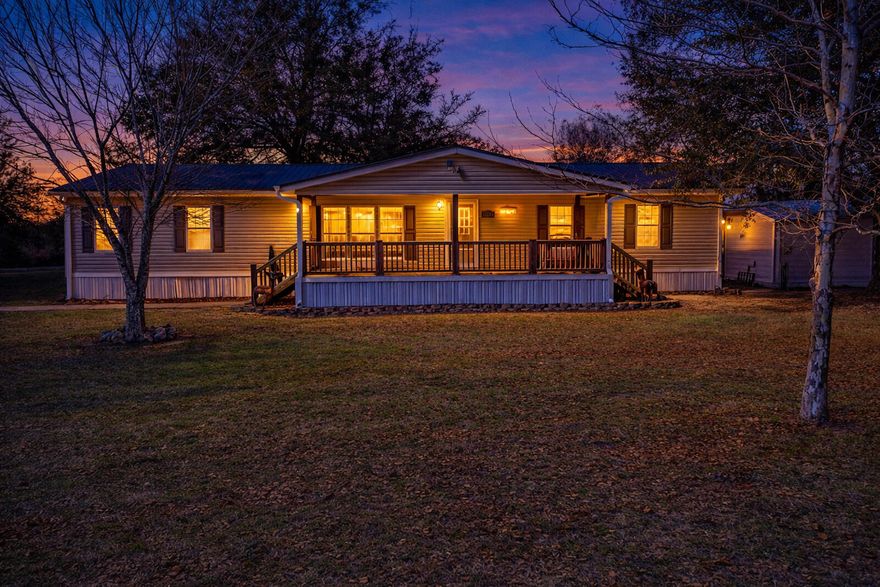 Situated on two peaceful acres, this property offers the comfort and freedom of country living with room to truly make it your own. The peaceful setting allows you to enjoy a slower pace while still having the space and functionality needed for everyday life.

The interior features a split floor plan designed for privacy and easy living. The spacious kitchen provides abundant counter space and a natural gathering area, making it ideal for both daily routines and entertaining.

A covered front porch adds to the home's charm, offering a welcoming place to enjoy morning coffee or relax in the evenings while overlooking the property.

The pole barn enhances the property's versatility, providing excellent space for storage, a workshop, hobbies, or equipment. With two acres to work with, there is ample opportunity to create the outdoor setup that fits your lifestyle.

For those seeking space, flexibility, and a peaceful setting, this property presents a wonderful place to call home.