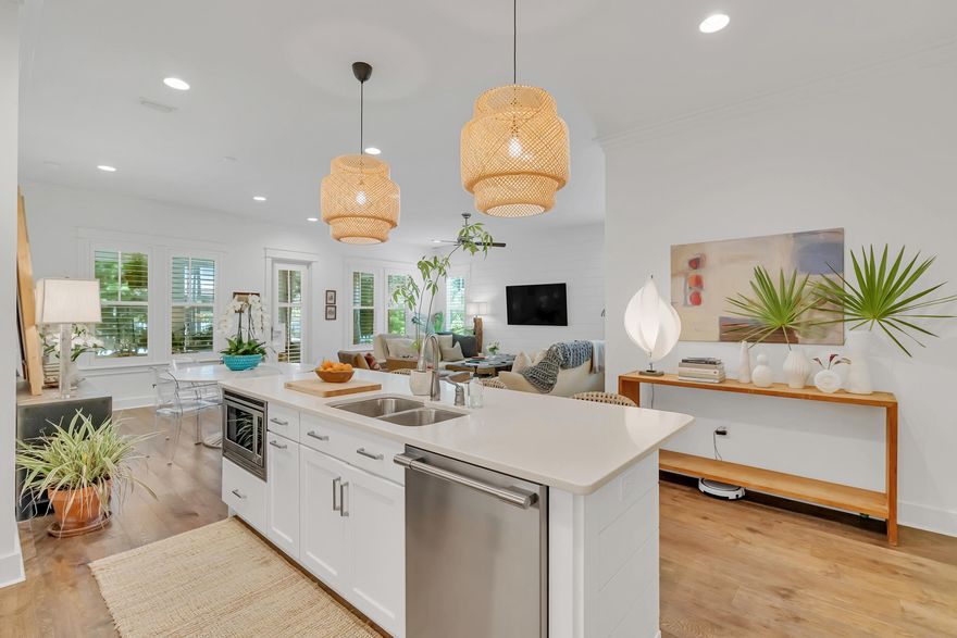 Welcome to this beautifully designed 4-bedroom, 3-bath home with thoughtfully crafted living space, complete with a spacious 2-car garage. Step inside to discover the main living area, creating an open and inviting atmosphere. The kitchen is a chef's dream, featuring quartz countertops throughout, under-cabinet lighting, a stainless steel vent hood, and a suite of professional Frigidaire Series stainless steel appliances.

Elegant Medallion hardwood flooring flows through the main living spaces and into the master bedroom, which is further enhanced by detailed crown molding. Each bathroom is finished with timeless tile, blending function and style effortlessly. Just off the screened porch, a poured concrete pad with a gas stub-out is ready for your grill, perfect for outdoor entertaining. Every detail in this home has been considered for both comfort and sophistication.
Watersound Origins offers more than just a beautiful home; it provides a lifestyle. With a 6-month minimum lease policy, the community welcomes both primary and second homeowners, making it an ideal location for year-round living or seasonal escapes. This community is ideally situated near the stunning beaches of 30A, as well as shopping, dining, and entertainment options. The Village Commons serves as a hub for residents, featuring a resort-style swimming pool, fitness center, sports courts and Origins Golf Club.  The community also boasts parks and walking trails. Experience a lifestyle that combines modern convenience with an appreciation for nature. This home at Watersound Origins is truly a rare find.