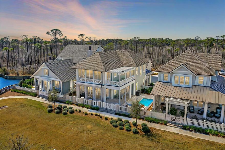 Tucked behind the gates of Regatta Bay, this custom Destin retreat was designed for the buyer who wants luxury without compromise. A home that feels elevated, private, and built for the way people actually want to live on the Emerald Coast.

From the moment you enter, the home delivers a warm, refined atmosphere with soaring ceilings, rich architectural detail, natural light throughout, and seamless indoor-outdoor flow. The open-concept design was made for entertaining, whether hosting friends around the chef's kitchen, opening the living space to the resort-style pool area, or enjoying quiet evenings after a day on the water or golf course.

The kitchen anchors the home with premium finishes, custom cabinetry, quartz countertops, high-end appliances, and an oversized island that naturally becomes the center of the home. The main living areas feel both sophisticated and comfortable, blending luxury finishes with an inviting coastal warmth that is difficult to find in newer construction today.

The primary suite offers a true private retreat with spa-inspired finishes, generous space, and direct access to the outdoor living area. Additional guest suites provide flexibility for family, entertaining, or working remotely while maintaining privacy throughout the layout.
 Outside, the backyard was designed to feel like a private resort. The pool, covered outdoor living space, and lush tropical surroundings create an atmosphere that feels worlds away while still being minutes from Destin's beaches, boating, dining, shopping, and entertainment.

Located inside one of Destin's premier gated golf communities, Regatta Bay offers a lifestyle centered around convenience, luxury, and recreation with golf, tennis, walking trails, and close proximity to the marina and Gulf waters.

This is more than just a beautiful home. It's a rare opportunity to own a refined coastal retreat in one of Destin's most desirable communities.