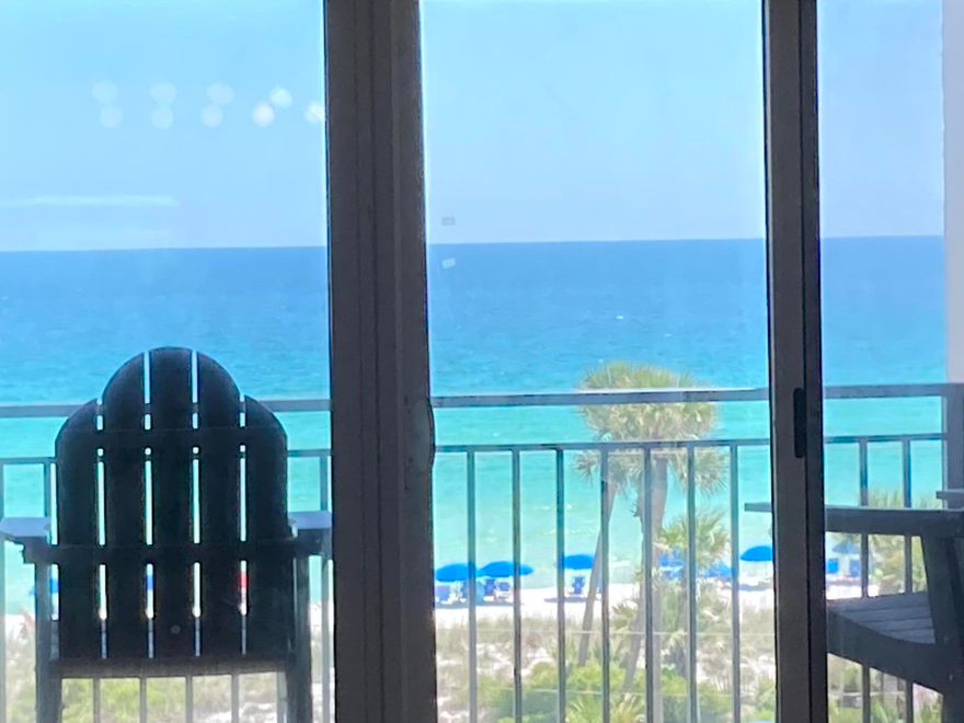 Check out this freshly painted, well maintained 5th floor unit that is beautifully decorated in a beachy vibe and has stunning views of the emerald green waters of the Gulf.  Emerald Isle is located on the white sand beaches of the Emerald Coast of Florida and offers not only the beautiful beach but also a Gulf front pool, BBQ area and a tennis/pickle ball court.  No need to bring your sandy beach equipment up to the unit. Instead, use the convenient storage cage on the ground floor that conveys with the unit. Emerald Isle Condominium recently completed a multimillion-dollar restoration to the building to include repairing concrete, waterproofing and painting the building, elevators, replacing railings and resurfacing the parking lot. Buyer to verify all dimensions and square footage.