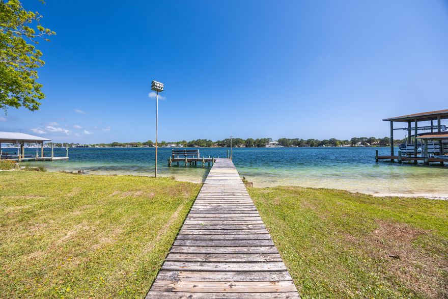 Is there a 4-bedroom waterfront home in Fort Walton Beach with deep water access and Gulf connectivity? 239 Beachview Dr presents a rare opportunity to own a .39-acre deep-water bayfront property with direct access to the Gulf of America via East Pass, offering exceptional potential to remodel or build new in a premier boating location.

This is a compelling opportunity for buyers, builders, and investors seeking a custom waterfront estate, a value-add redevelopment opportunity, or a high-demand short-term rental property. Short-term rentals are allowed, adding flexibility and income potential in a sought-after coastal market. Whether you choose to renovate the existing home or build new, this 4-bedroom waterfront home in Fort Walton Beach stands out as a rare opportunity to secure deep water access, an estate-sized lot, and long-term value.

Situated on Choctawhatchee Bay, 239 Beachview Dr offers a unique combination of existing livable space and long-term development potential on an estate-sized waterfront lot in a protected bayfront setting with unobstructed water views. The home features 4 bedrooms, 2 bathrooms, and 1,658 square feet, including a Florida room that can be reimagined to maximize the waterfront backdrop. The expansive .39-acre lot is the true highlight, presenting a rare bayfront offering with build-ready potential, ideal for those looking to design a custom waterfront estate or create a legacy property. Deep water access supports large vessels and sportfishing boats, with the opportunity to add a private dock tailored to your boating needs.

With direct access to the Gulf of America via East Pass, this location is well suited for offshore boating and deep-sea fishing. From your private sandy shoreline, enjoy captivating sunrises and moonrises that define extraordinary waterfront living. The setting supports a full range of water-based activities including boating, kayaking, jet skiing, paddleboarding, snorkeling, and fishing. Choctawhatchee Bay is widely recognized as a fisherman's delight, with miles of bayous and tributaries extending from the bay, offering diverse fishing environments and year-round opportunity for anglers.

Spend your days kayaking, jet skiing, boating, fishing, or snorkeling, then take your boat across the bay for an evening in Destin Harbor with waterfront dining and entertainment. The outdoor space offers a natural canvas to design your waterfront haven, whether creating a zen-inspired escape, an expansive entertaining area, or a private coastal retreat surrounded by water, wildlife, and open skies.

Deep water access properties like this rarely become available on Choctawhatchee Bay, especially with a .39-acre estate-sized footprint and this level of boating accessibility. This is a location homeowners hold onto, making opportunities to purchase here limited. 

Schedule your private showing to experience the setting, scale, and potential of this waterfront property firsthand.

All information is deemed reliable; however, accuracy should be independently verified by interested parties.