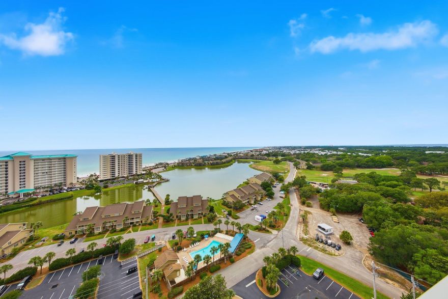 Perched on the 17th floor of Ariel Dunes II, Unit 1709 offers breathtaking, unobstructed Gulf views with panoramic vistas of emerald water and sugar-white sand. This fully furnished, turnkey condo has been extensively renovated throughout, featuring luxury vinyl plank flooring, updated white tile, modern lighting, and designer finishes. The beautifully reimagined primary bath showcases a custom oversized tiled walk-in shower, quartz countertops, updated vanity, and owner's closet. The guest bath has also been tastefully updated with quartz counters, new tub surround, and refreshed finishes. The modernized kitchen features professionally painted cabinetry, a sleek black granite composite sink, and matching black faucet for a clean coastal aesthetic. Designed for maximum rental appeal, the floor plan includes a dedicated bunk room and flexible sleeping arrangements accommodating up to 8 guests. Short-term rentals are permitted, making this an outstanding investment opportunity or personal beach retreat. Resort-style amenities include pools, fitness center, beach access, and ample parking in one of the Emerald Coast's most sought-after destinations.