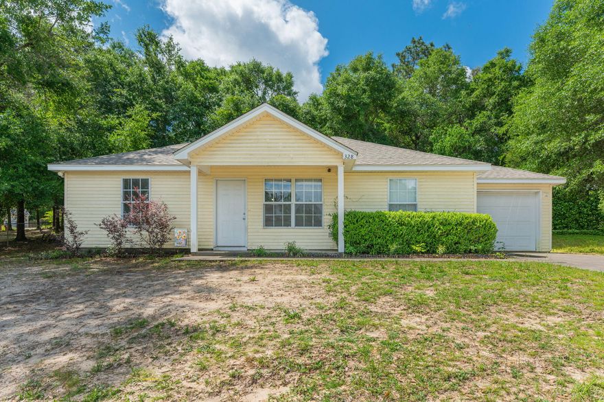 Popular split bedroom floor plan. The Living Room, Dining Area, Kitchen and Bathrooms have tiled flooring. Bedrooms are carpeted.  Front porch and open back patio. 1-Car garage. There is an extra parking pad along the side of the driveway. Inside Laundry Room. Quiet neighborhood in town!