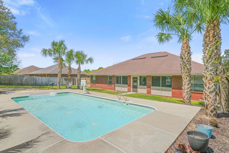 Welcome to this beautifully maintained 4-bedroom, 2-bath all-brick home situated on a spacious .52-acre corner lot--offering both privacy and room to enjoy Florida living at its finest.
Step inside to find a well-designed floor plan featuring tile flooring throughout the main living areas and cozy carpet in the bedrooms. A dedicated office with elegant French doors provides the perfect space for working from home or a quiet retreat.
 The primary suite is a true sanctuary, complete with a tray ceiling, dual vanities, a separate garden tub and shower, and two walk-in closets for ample storage.
One of the standout features of this home is the incredible outdoor space. The fully privacy-fenced backyard is your own private oasis--featuring a sparkling in-ground pool, lush landscaping, and beautiful palm trees throughout. Whether entertaining or relaxing, this backyard is designed to impress. Enjoy the outdoors year-round from the screened-in back porch, with convenient access from the home--including a secondary bedroom with direct porch entry, ideal for guests or flexible use.
Additional features include a Vivant security system that conveys with the home, providing added peace of mind, as well as a sprinkler system to help maintain the beautifully landscaped yard with ease.
The front yard is equally inviting, showcasing well-maintained landscaping that enhances the home's curb appeal.
This property offers the perfect combination of space, functionality, and exceptional outdoor living--don't miss your opportunity to call it home!