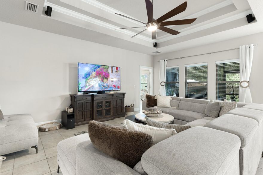 Welcome home to 114 Maddox Street in the highly sought-after Peach Creek community - where luxury finishes, thoughtful design, and relaxed coastal living all come together. This beautifully maintained, single-story home offers 3 spacious bedrooms, 2 bathrooms, and approximately 1,886 sq. ft., plus the additional heated and cooled space compliments to the AC-installed in the garage. From the moment you step into the large, welcoming foyer, you'll feel the sense of openness and quality that flows throughout the home. The open-concept living area features elegant tray ceilings that add volume and sophistication, while tile flooring runs seamlessly through every room - no carpet anywhere - for a clean, modern look and easy maintenance. The kitchen is a true centerpiece, boasting crisp white cabinetry, granite countertops, and a functional layout that makes everyday living and entertaining feel effortless. Just off the main living spaces, the screened-in back porch and extended lanai create a relaxing indoor-outdoor retreat, perfect for morning coffee, evening cocktails, or simply escaping the summer sun in comfort.

The primary suite is a private sanctuary, highlighted by tray ceilings and an en suite bathroom designed for luxury and convenience. Enjoy dual sinks in the vanity, a stand-up shower, and a separate soaking tub that invites you to unwind at the end of the day. With its thoughtful layout and upgraded finishes, this home is truly move-in ready and styled for modern living.

Located in the family-friendly Peach Creek community, 114 Maddox Street offers the best of both tranquility and convenience. You're just a short drive from the vibrant 30A lifestyle, beautiful beaches, schools, and premier shopping and dining. If you're looking for a stylish, low-maintenance home with a luxurious feel and inviting indoor-outdoor living, this Peach Creek gem is a must-see!