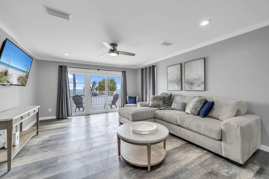 Directly across the street from the Gulf, this 2 bedroom, 2 bathroom townhome offers quick beach access, Gulf views, and updates that help reduce near-term maintenance. Two public beach access points are nearby, and the home is being sold fully furnished, making it a practical option for personal use, a second home, or rental use. For buyers exploring added rental flexibility, the neighboring townhome is also available, creating a rare opportunity to own side-by-side units.
Inside, the layout is set up to comfortably host guests with one king bed and two queen beds. The kitchen, bathrooms, and flooring were renovated in 2019, and the entire unit was freshly painted in 2025, including the walls, trim, and doors. 
 All furnishings were also replaced in 2025, giving the interior a clean, updated feel. A full-size washer and dryer adds everyday convenience.
The living area opens to a private patio where you can enjoy Gulf views and coastal breezes. A fenced backyard provides private outdoor space to unwind after time at the beach. The home also includes a private garage for beach gear, bikes, and other coastal essentials, plus additional driveway parking for guests.
Nearby destinations include Pier Park, St. Andrews State Park, marinas, waterfront dining, shopping, and local restaurants. Buyer to verify all dimensions.