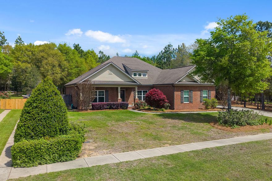 Are you searching for privacy, peace, and true country living? Look no further, this is the home you've been waiting for. Tucked away at the end of the subdivision, this stunning Randy Wise-built home offers the perfect blend of seclusion and style. From the moment you arrive, you're welcomed by a custom extra wide driveway and sidewalk that extends beyond the fence for a RV or boat, leading to a spacious side-entry garage. This Craftsman-style home showcases timeless design paired with modern comfort. The heart of the home features an open-concept living, dining, and kitchen area--ideal for both everyday living and entertaining. Throughout the 4-bedroom, 2-bath layout, you'll find elegant upgrades including crown molding throughout, 6-inch baseboards, and granite countertops. The kitchen is a true showstopper, complete with professional-grade stainless steel appliances, custom cabinetry, and a large island that overlooks the family room. The private primary suite offers a relaxing retreat with plush carpeting and a spa-inspired bathroom featuring an oversized walk-in shower with glass enclosure, garden style soaking tub and an expansive walk-in closet. Enjoy year-round outdoor living in the Florida room, built by Titan Sunrooms, featuring impact glass windows for comfort and durability, as well as a split AC/Heat unit. Step outside to a beautifully manicured, fully irrigated backyard oasis. The fully fenced yard also includes a 14x14 outbuilding constructed with brick and Hardie board, perfect for storage or hobbies.
This exceptional property truly has it all, come and view today.