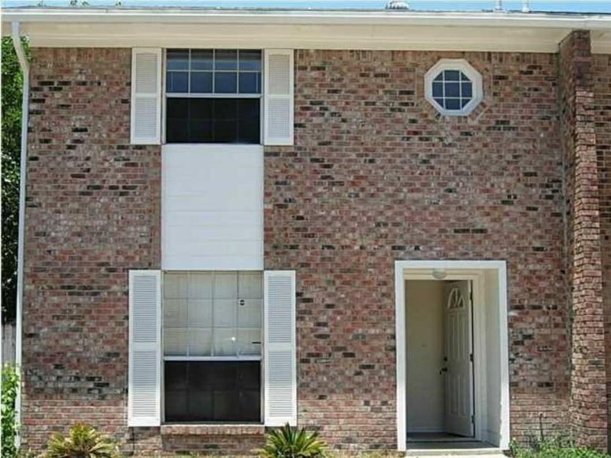 Roof replaced in 2005. New A/C in 2011. End unit with beautiful tile and wood laminate floors. Polished wood stairs. Added family room with interior laundry/utility room. Lots of storage space. Property appraiser site does not accurately reflect square footage of heated area. No carport, siding is Hardiplank with brick. This property can be accessed from both front and rear...plenty of parking and room to install a carport. Buyer to verify all measurements. Seller's agent is related to seller.