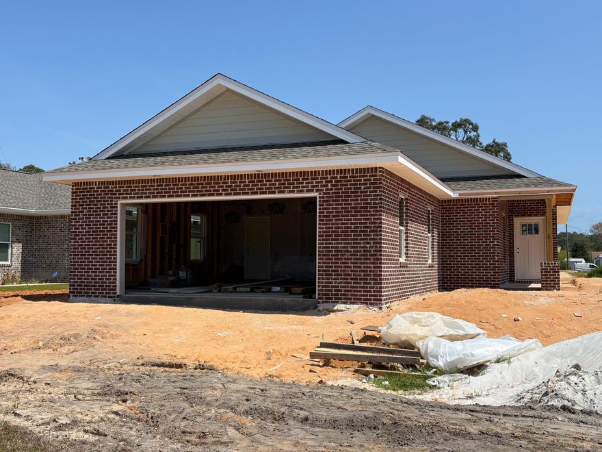 NEW CONSTRUCTION HOME just in time for summer (June)!! NOTE: Finished photos are of a previous build, home is currently under construction. This home is being built by Hi Lite Homes in Villa Tasso, one of the fastest growing communities in the Niceville area!!  This adorable and AFFORDABLE 3 bedroom, 2 bath brick home with a 2-car garage  features an open, split bedroom floorplan that is sure to please all buyers. The fully sodded and irrigated yard is just the perfect size AND it backs up to an alleyway providing access into the back yard for convenience. Interior features include shaker style cabinets, granite counters, stainless appliances, LVP flooring and even blinds for the windows. The home is located on quiet street where 7 additional new homes will be built on the same block.  Homes in this price range go fast so don't miss your opportunity to make this NEW home your own!