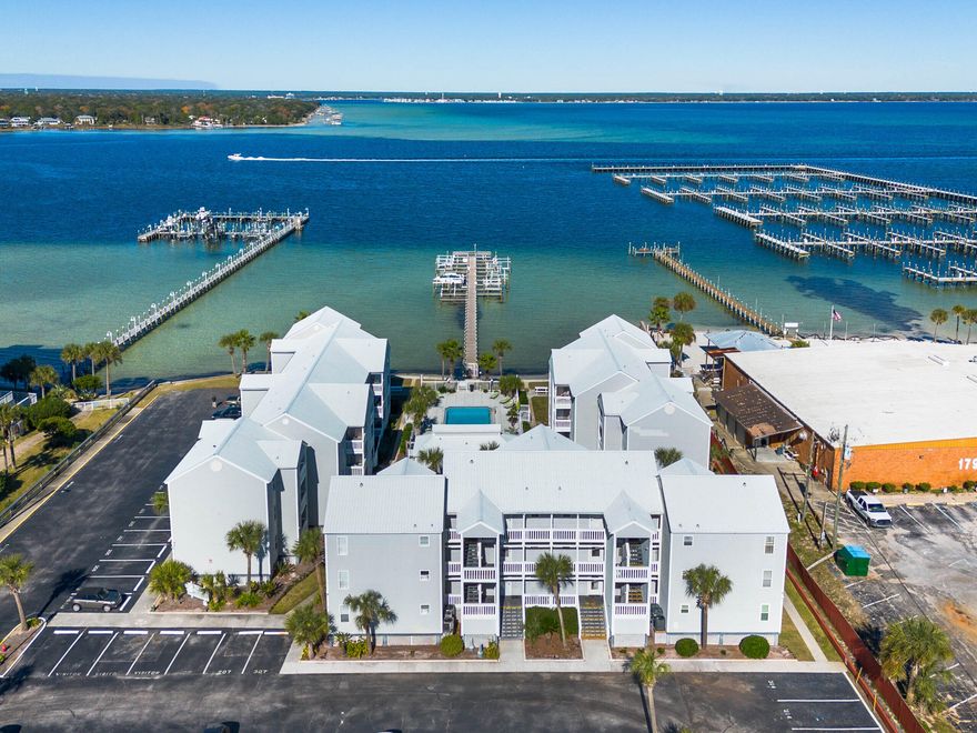 Coastal Elegance Meets Island Living! Discover the magic of Florida's Emerald Coast in this beautifully remodeled waterfront condo, perfectly situated between the Gulf of America and Choctawhatchee Bay. This turnkey 2-bedroom, 1-bath retreat offers a thoughtfully designed living space, blending modern sophistication with relaxed coastal charm. Fully furnished and move-in ready, the light-filled open layout features stylish finishes and beach-inspired décor, creating an inviting atmosphere that comfortably accommodates up to six guests--ideal for a personal getaway or a lucrative vacation rental. Enjoy serene water views, legendary Bay sunsets, and the convenience of being just steps from the sugar-white sands of the Gulf of America and moments from the Okaloosa Island Boardwalk and Pier, as well as the Gulfarium, downtown Fort Walton Beach and Destin  where dining, shopping, and entertainment await. This family friendly low density resort-style community offers a sparkling waterfront pool, private dock access for boating or paddleboarding, and BBQ areas perfect for gathering with friends and family, all within an owner pet friendly environment. Whether you're seeking a full-time residence, a seasonal escape, or a smart investment opportunity, this exceptional waterfront condo delivers the ultimate blend of style, comfort, and value in one of Florida's most desirable island destinations. Your slice of paradise awaits--schedule your private showing today!