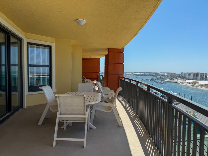 Fractional ownership opportunity - 1/8 share with 6 weeks of annual use! This is the lowest-priced unit available in this floor plan. Enjoy a spacious 3-bedroom, 3-bathroom corner unit with over 500 sq. ft. of balcony space and unmatched views of Destin Harbor, East Pass, Crab Island, and the Gulf. Each bedroom offers comfort and privacy, with balcony access from the living area and select bedrooms to take in the coastal views. Resort-style amenities include a pool, two hot tubs, a full-service spa, and a fitness center. Additional services feature a 24-hour front desk, bell service, on-site dining with room service, and complimentary beach service with chairs and umbrellas.  All of this is just an elevator ride away from HarborWalk Village.