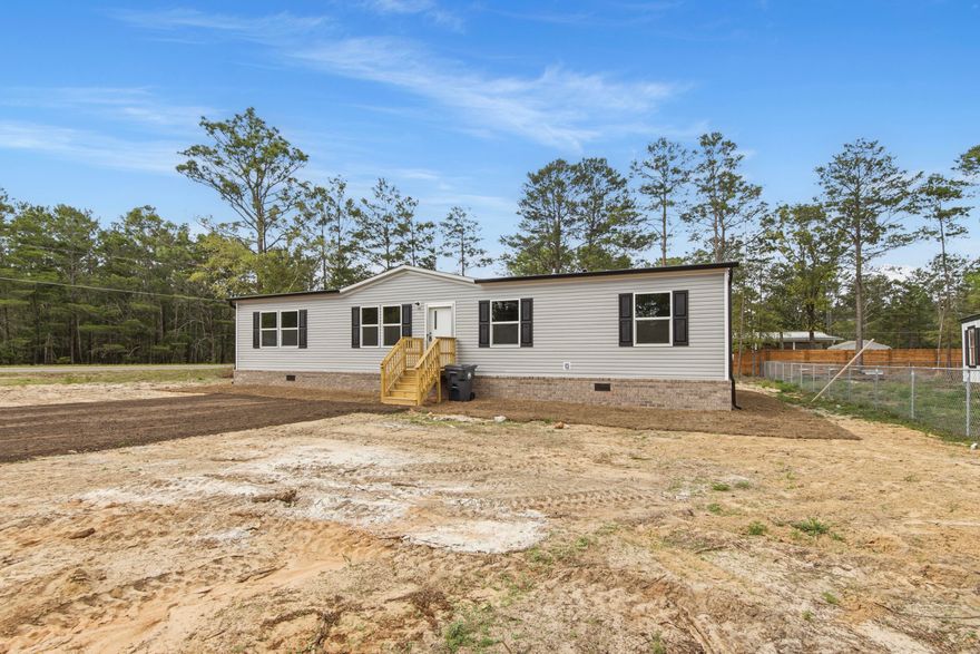 Professional photos coming soon on this BRAND NEW construction home just completed at an accessible price point in DeFuniak Springs. Friendly floorplan allows for comfort and functionality. Featuring gutters, true brick skirting, and pilled pavement driveway, this home is upgraded from a lot model. Room sizes for allow for versatility for each family member to have their own space, for hobbies, or guests. Home is situated on a lot that is manageable, with NO HOA.