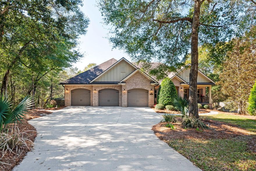 Welcome to this refined custom home tucked away on a private cul-de-sac in the prestigious Swift Creek community.  This exceptional residence built by Randy Wise offers a rare blend of architectural elegance, modern comfort, and tranquil natural surroundings. Encompassing 4,546 square feet of thoughtfully designed living space, this home delivers refined finishes, functional luxury, and seamless indoor-outdoor living.
Warm, rich hardwood floors flow throughout the main living areas, complemented by extensive crown molding, recessed lighting, and an integrated surround sound system. The open-concept design is filled with natural light, with expansive picture windows framing serene wooded views and creating a peaceful backdrop throughout the home. The heart of the home is a stunning chef's kitchen featuring custom creme cabinetry with glass display uppers, under-cabinet lighting, granite countertops, a large center island with seating, double ovens, gas cooktop with stainless hood, and a walk-in 8' x 5' pantry. Designer pendant lighting adds a sophisticated touch, while the kitchen opens effortlessly to the dining and living areas; ideal for both entertaining and everyday living.
The adjoining family room is bright and inviting, anchored by oversized windows overlooking the private deck and lush tree canopy beyond. Just outside, a grilling deck provides the perfect extension of indoor living space.
Upstairs, the luxurious primary suite offers a true retreat, complete with a spacious custom walk-in closet featuring built-in shelving, double hanging areas, and ample storage. Two additional bedrooms and a dedicated office/study complete the upper level, offering flexibility for work or relaxation.
The fully finished walk-out lower level is designed for entertaining and lifestyle versatility. A well appointed bar and kitchenette include a refrigerator, ice maker, microwave, and dishwasher. A hidden 500-bottle, environmentally controlled wine cellar sits discreetly behind a sliding barn door; a striking yet functional design feature. This level also includes a bedroom, full bath, gym/multi-purpose room, additional office, craft room, family room, and generous storage.
Step outside to your private outdoor oasis. The expansive paver terrace surrounds a stunning freeform saltwater pool with elevated spa, creating a resort-style setting. The spa cascades into the pool below, and the entire space overlooks peaceful wetlands and mature wooded landscape, offering exceptional privacy. An in-ground mosquito misting system ensures year-round enjoyment, while landscaped lighting and paver pathways enhance both ambiance and accessibility.
Additional premium features include:
Whole-house Generac generator (2019), Hurricane impact windows in dining room and primary suite, Built-in security system, Central vacuum system, Custom Built In Closets, Three-car garage with impact-resistant doors, epoxy flooring, custom shelving, and slat-wall storage.
This is more than a home, it is a private retreat offering comfort, security, and resort-inspired outdoor living in one of the area's most sought-after neighborhoods. Sellers are kindly requesting ALL OFFERS/HIGHEST AND BEST BE SUBMITTED BY 5PM SATURDAY 2/21. TY!