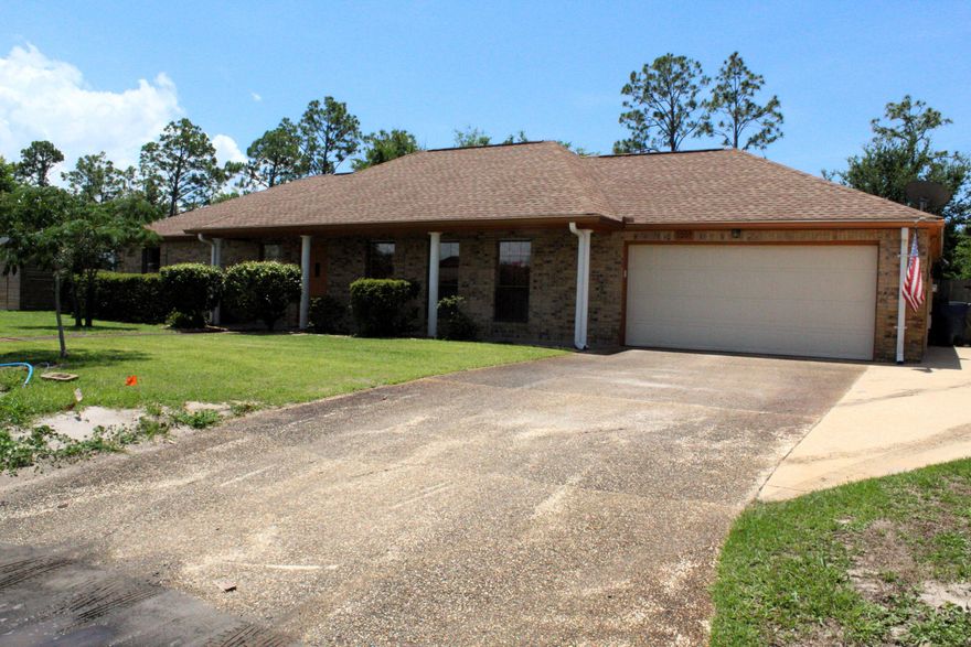 Welcome to this beautifully maintained all-brick ranch-style home featuring 3 bedrooms and 2 full bathrooms--where comfort, style, and practicality come together seamlessly. Nestled in a peaceful setting, this home offers the perfect blend of indoor charm and outdoor serenity. You'll love the open-concept kitchen with updated cabinetry that flows effortlessly into the inviting family room, complete with a cozy wood-burning fireplace. There's also a spacious formal dining and living area--ideal for hosting holidays and special gatherings. Step outside to unwind on the screened-in porch or enjoy the stunning water views from the backyard deck--perfect spots for your morning coffee or evening meals. The property includes a 2-car attached garage and an extra driveway space with  an exterior electric hookup--perfect for your RV or boat. The sprinkler system is on well water. Major updates include a 2019 roof, 2025 AC with air purifier, 2021 hot water heater, and installed impact-resistant windows (excluding the garage window). This move-in-ready gem offers both peace of mind and everyday comfort. Canal ends at the end of the street. Come see this wonderful home for yourself--you won't want to miss it!