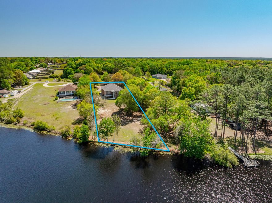 Experience Lakeside Luxury with this extraordinary Custom Built 4,508 sq. ft. One-Owner Lakefront Home in South Crestview, offering a serene retreat on 1.26 acres with 120 feet of frontage on a fully stocked 27-acre lake. There are several rooms that could be made into a 4th Bedroom!  Built in 2011 and meticulously maintained by its original owners, this unique property boasts exceptional features throughout.
Key Highlights:  Impressive Workshop: A 736 sq. ft. heated/cooled workshop with utility sink and rollup door, perfect for hobbies or storing a golf cart. An oversized 2-car garage and two spacious storage rooms complete the first level. Quality Construction: 2x6 framing, 9' ceilings throughout, 36' wide doors (except closets), and more than 450 sq. ft. of spray foam insulated attic space ensures energy efficiency. Modern Conveniences: Central vacuum system, Home Team in-the-wall pest control with termite bond, and two brand new HVAC systems (2022) for optimal comfort. Functional Main Level: Includes a spacious family room, well-appointed kitchen with wood cabinets, granite countertops, a dumbwaiter lift to the garage, large pantry, and breakfast bar. Adjacent sunroom leads to a screened porch, perfect for soaking in the lake views. A large laundry room with an island and an office add to the convenience. Primary Suite: Features a beautiful tray ceiling, expansive walk-in closet, and a thoughtfully designed en-suite bathroom with multiple vanities, Tiled Walk-In shower, and unique "drip-dry" closet with a drain for hand washables. Additional Living Space: There is a large Office next to the Primary Bedroom - Perfect for those who work from home. On the 2nd Level, there are also two guest bedrooms, a full bath, and a versatile parlor/bonus room. Carpeting is only found in the guest rooms, maintaining easy upkeep throughout. Extras: TVs are included, and a lawn tractor with a lift for maintenance is part of the sale. The property also features a storage shed and a scenic backyard leading to the water's edge. This is truly a one-of-a-kind property where you can enjoy peaceful lakefront living with modern amenities. Schedule your visit to fully appreciate the beauty and craftsmanship of this exceptional, One-Owner Home!
