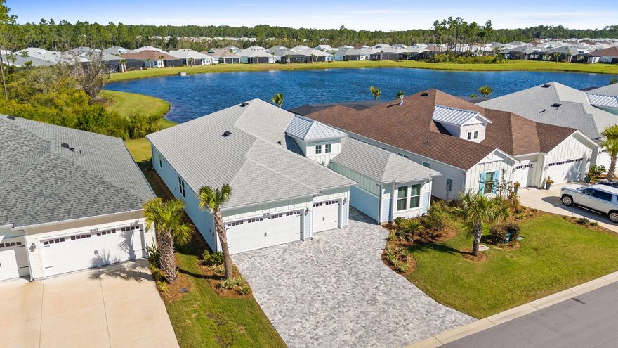 Rare Pond Lot! Close-in phase 4! Latitude Margaritaville Watersound, 55+ active lifestyle community! 7 miles from the BEACH! Trinidad Bay Island Collection | Pond & Preserve Views. Experience luxury coastal living in this HIGHLY UPGRADED, Trinidad Bay home perfectly positioned to capture tranquil pond and preserve views. Highlights of the home include: 3 Bedrooms | 3.5 Baths | Den/Office | 3-Car Garage. Hurricane IMPACT WINDOWS, Paver Driveway & Walkway | Quiet Island Collection Street. Step inside this open-concept floor plan featuring expansive light-filled living spaces, soaring ceilings, and sliding glass doors that open to a screened-in lanai with paver surround--ideal for relaxing or entertaining while enjoying peaceful nature views. The chef's kitchen is a showpiece with a gas cooktop, stainless appliances, wall oven and microwave, hood vent, upgraded cabinetry, and quartz countertops and backsplash for a seamless, high-end look. An oversized island and walk-in pantry make cooking and hosting effortless. The primary ensuite retreat overlooks the serene pond and features a Deluxe shower package with floor-to-ceiling tiled shower, frameless glass enclosure, overhead rain shower head-3 volume control valves, handheld shower w/slide bar, quartz countertops, and upgraded cabinetry. Two additional bedrooms each feature private ensuite baths with upgraded cabinetry, countertops, tile bathtubs and floors. A hall half bath for guest. The den/office offers flexibility, built-in cabinetry with a wet bar, and a wine cooler--perfect for work or entertaining. Throughout the home, enjoy Revwood by Mohawk laminate flooring, with plush carpet in the primary suite for added comfort. The spacious laundry room includes an abundance of cabinetry, granite countertops, sink, and washer/dryer. Additional upgrades include screened covered, paver lanai overlooking the pond and preserve, landscape lights, custom electrical lighting for artwork throughout, tankless water heater with a internal circulating pump, 3 car garage, upgraded garage door openers with built-in cameras, garage insulation, attic storage, plumbed soft water loop and drain, exterior flood lights with motion sensors. Gas drops for dryer and on the exterior lanai. High/Low Cat6 dual outlets in the great room, den/office and primary suite. Pre-wired for a pool! Professional landscaping, driveway and walkway pavers for outstanding curb appeal. This stunning Island Collection home embodies the Latitude Margaritaville lifestyle--where luxury, leisure, and location come together seamlessly. Living in Latitude Margaritaville Watersound means embracing a true resort-style, active adult 55+ community, coastal lifestyle designed for fun and relaxation. At the heart of it all is the Town Square where live entertainment fills the air on a daily basis and every Fri/Sat. night! Homeowners enjoy: The Resort-style pools- perfect for lounging in the Florida sunshine or enjoying a swim with friends. State-of-the-art fitness center & group classes - including yoga, spin classes and lap pool and spa, water aerobics to name a few. Walking, biking, and golf cart trails that wind through the community with easy access to all amenities and a underpasses for safe and convenient access throughout the neighborhood. Sports courts - including pickleball, tennis, and bocce, basketball encouraging friendly competition and active living. Kayak launch for adventure seekers, Last Mango Theater for shows and events, ceramics and wood working shops, pet grooming and a dedicated dog park. Beyond the amenities, Latitude Margaritaville Watersound offers a low-maintenance lifestyle--with lawn care included in HOA dues, a 10 structural warranty, giving residents more time to enjoy the beach, boating, or exploring nearby Panama City Beach and 30A. Whether it's a sunset golf cart ride, cocktails by the pool, or mingling with neighbors at one of the many social groups. Experience the lifestyle!