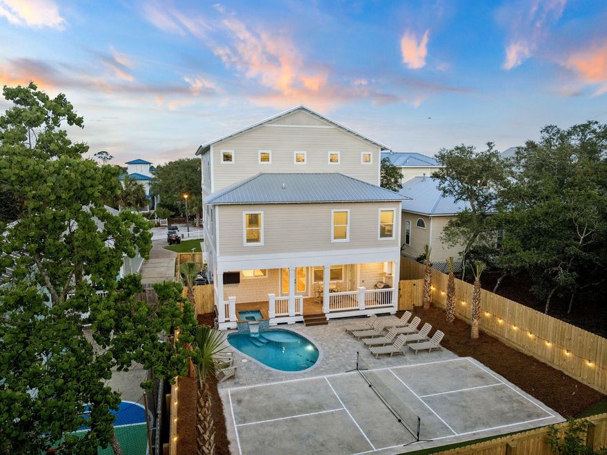 Welcome to 86 Sunfish Street, a brand new 2026 construction masterpiece in Destin's coveted Kokomo Kove community, one of the few neighborhoods in Crystal Beach with private deeded beach access right at the end of the street. This three-story coastal retreat delivers 7 bedrooms, 9.5 bathrooms, and 4,227 square feet of thoughtfully designed living space, making it an exceptional primary residence, second home, or premier vacation rental investment.

From the moment you arrive, the curb appeal sets the tone: a paver driveway leads to a striking HardiePlank and shake-siding exterior topped with a standing-seam metal roof, with three levels of covered porches and balconies that glow beautifully at sunset.
The open-concept first floor flows seamlessly from the living room through the dining area to a chef's kitchen featuring white shaker cabinetry, a professional gas range, dual dishwashers, and a sprawling quartz island dressed in wicker pendant lights. Each of the seven bedrooms has been designed as its own retreat, with en-suite or private baths appointed with double-sink quartz vanities, arched brass-framed mirrors, and designer lighting. An upper-level kitchenette with stainless appliances adds natural separation, making it ideal for multi-family stays or maximizing rental flexibility. Outside, a private pool and built-in spa, seamlessly integrated into the first-floor deck, anchor a paver courtyard within a fully fenced, private yard. A regulation pickleball court gives guests of all ages something to enjoy, while the sweeping third-floor covered porch with vaulted ceiling and treetop views is the kind of retreat that makes a beach house legendary.

Short-term rental-friendly with the established charm of Crystal Beach right outside your door. This is Emerald Coast living at its finest.