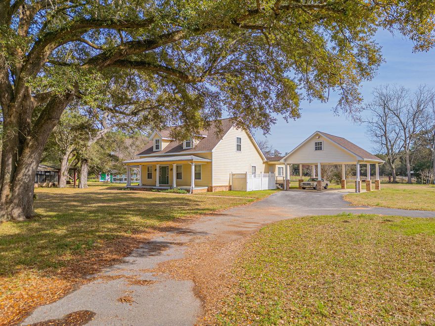 Welcome home, as you enter the private gate you'll feel privacy and tranquility this property has to offer. At the end of the private drive you'll find the farm house, oversized detached garage with studio apartment, old red barn/workshop that has been well maintained. The large white letters that spell barn came from the demolition of Ruby Tuesday on Hwy. 29.  A screened room w/brick knee wall, sitting area w/porch swing are close to the house. The greenhouse, potting shed, chicken coop, another small barn and watch tower all surround the house on 9 acres where you'll find a raised garden beds, old oak trees, fruit trees which include pecan, fig mulberry, blueberry, persimmon and loquat. There's a 26 year old Ginkgo Biloba in the north garden.  The display in the fall w/brightly colored yellow leaves is a highlight of the farm. Once you enter the home, you'll fall in love with all the woodwork from its hardwood floors throughout (except wet areas), encased door frames and windows, wood plank ceiling in the office, to the historical wood used on the fireplace mantle (100 year old heart pine). The stairs and stair railing are also made of repurposed heart pine from homes built in Pensacola in the early 1900s. The primary bedroom is oversized with a large en-suite, large shower/steamer. Laundry room has sink, upper cabinets and pantry close to kitchen.  The kitchen/dining offers plenty of cabinets, solid surface counter tops, farm house sink, island, double ovens, built in microwave, electric cooktop, refrigerator and even a buffet cabinet in dining area. The living room is grand with its vaulted ceiling and wood burning fireplace. The office has a wood plank ceiling and an entrance to the outside. The sunroom you can enjoy all year long.  A 1/2 bath at the stairwell and upstairs there's two oversized bedrooms and a full bath.  This property has a lot to offer and is a must see.