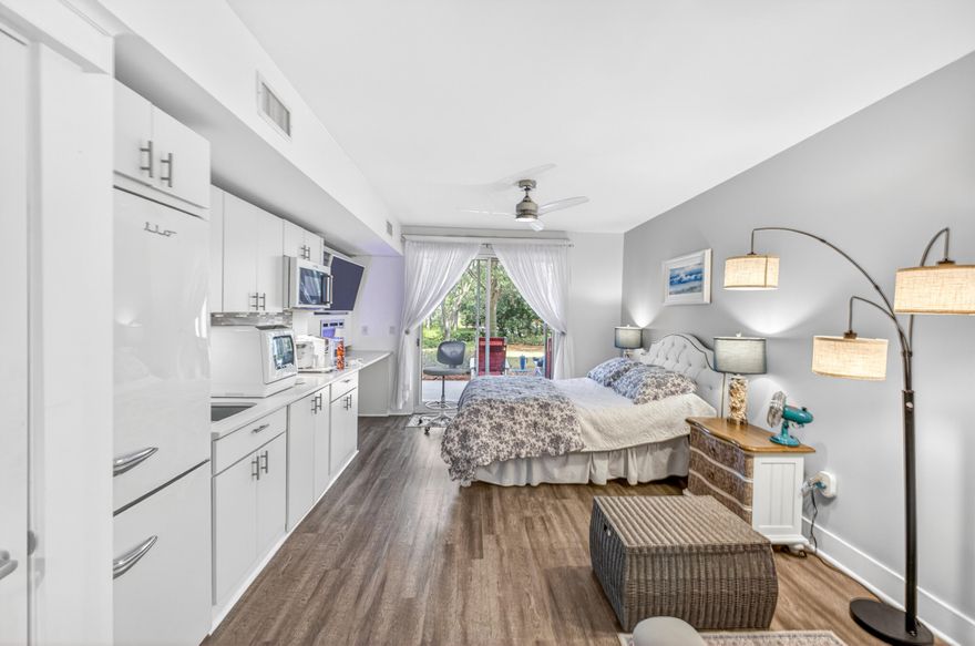 Experience effortless coastal living in this beautifully renovated first floor studio (ground-floor and garage below)-an exceptional opportunity for both personal use and investment. Thoughtfully redesigned from top to bottom, this space blends style, comfort, and functionality with elevated, high-end finishes throughout. The custom kitchen is a true standout, featuring sleek cabinetry, Silestone countertops with a breakfast bar, and a stylish tile backsplash. High-end appliances include a KitchenAid convection microwave oven with built-in exhaust ventilation above a two-burner ceramic induction cooktop, a large apartment-size Retro iio refrigerator/freezer, and a convenient countertop dishwasher. Under cabinet lighting and a large sink with a new high-end faucet and disposal adds everyday convenience. 

The open living area is designed for both relaxation and style, complete with a high-end Samsung tv, recessed, Framed, with separate box called the One Connect with sound system, ambient mood lighting, and a modern electric fireplace with heat perfect for cozy evenings. Hunter Douglas automatic shades and contemporary ceiling fans add a refined touch throughout the space.

The spa-inspired bathroom offers a serene escape with a new vanity, rain showerhead, designer tile accents, updated fixtures, and a space-saving smoked glass / wood barn door. A lighted medicine cabinet and elegant lighting complete the polished look.

Additional upgrades include luxury vinyl plank flooring throughout, a GE ventless washer/dryer combo, HVAC replaced in 2022, water heater replaced in 2024, and fresh interior paint. The building is also equipped with a Halo water detection system, providing added peace of mind.

Includes large patio with beautiful, relaxing view of perfectly manicured grounds, including live oaks, evergreen forests, and freshly planted seasonal flower gardens.  Patio located on tree lined wide, paved walking path.  Short distance to breakfast cafes, ice cream shops, and many, great restaurants with nightly live music, and a long peer over the Bay for fishing or watching the sunset.  Sandestin's private beautiful beaches are a short bike ride or golf cart ride away, and golf courses are a quick golf court ride away.  Pickle ball courts and marina are also a short distance away.

Ideally situated on the ground floor for easy access, this studio perfectly captures the balance of modern comfort and coastal charm. A rare find that must be seen to be fully appreciated.

As an introduction to the Sandestin lifestyle, we invite our new owners to explore amenities that make Sandestin special. The listing brokerage and seller(s) are presenting the buyer(s) of this property with (2) 90-minute rounds of Tennis court time, a golf foursome at one of our three championship courses, and a round of golf for up to four (4) players at the unrivaled Burnt Pine Golf Club.

Sandestin Golf and Beach Resort features more than seven miles of beaches and pristine bay front, four championship golf courses, 15 world-class tennis courts, a 226-slip marina, a fitness center, spa and celebrity chef dining. Shop, dine and play at the charming pedestrian village, The Village of Baytowne Wharf and more. Inside the gates of the resort, residents enjoy a balanced lifestyle of high-class living, spanning the 2,400 acres from the beach to the bay. Everything within the gates of the resort is accessible by golf cart or bicycle. The entire resort is interconnected by miles of pedestrian, bike and golf cart paths that weave through groves of live oaks, meandering past natural lagoons, fountains, man-made lakes, and meticulously landscaped fairways.