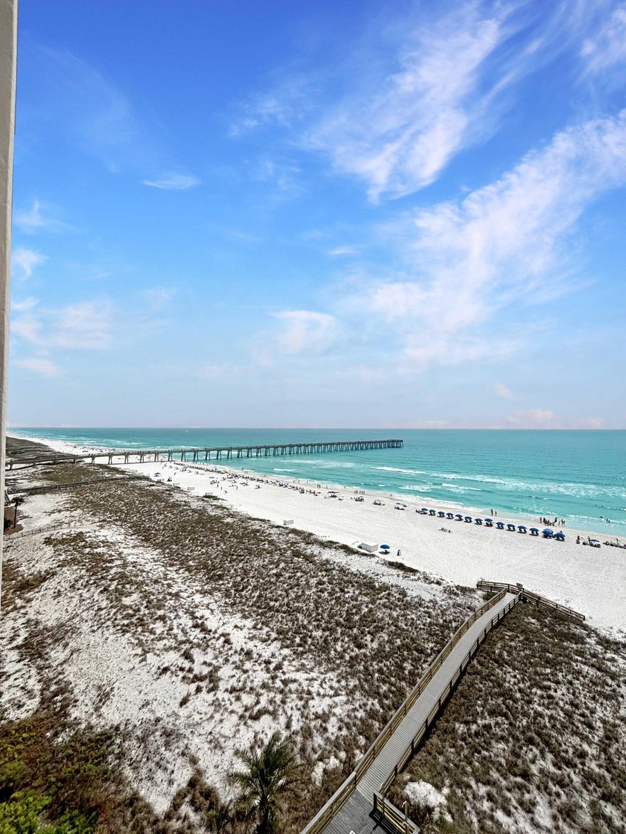 Welcome to your slice of paradise at Navarre Beach! This stunning 8th-floor condo in Regency Tower, Unit 811, offers breathtaking, unobstructed views of the emerald-green Gulf waters and sugar-white sands that make this area so sought after. Step inside to discover a light-filled, coastal-inspired interior designed for both comfort and relaxation. The open-concept living and dining area flows seamlessly onto a private balcony, which spans 30 feet long and 8 feet deep- perfect for morning coffee, sunset cocktails, or simply soaking in the sound of the waves. Large sliding glass doors bring the outside in, showcasing panoramic Gulf views from the main living space. The well-appointed kitchen features ample cabinetry and granite counter space, making it ideal for entertaining or preparing any meals after a day at the beach. The spacious primary suite offers a peaceful retreat with views of Navarre Pier from your bed, while an additional bedroom provides plenty of room for guests or rental potential with two queen beds with views of the sound. This unit has a unique addition to its sale, a deeded covered parking spot (W4), a rare sought after feature! Regency Tower is known for its quiet, uncrowded beaches and desirable amenities, including a Gulf-front pool, direct beach access, and a relaxed, laid-back atmosphere that's hard to find elsewhere along the coast. Whether you're searching for a primary home, second home, vacation getaway, or income-producing investment, Unit 811 delivers the perfect combination of location, views, and coastal charm. Don't miss your opportunity to own a piece of Navarre Beach--often called Florida's best-kept secret.