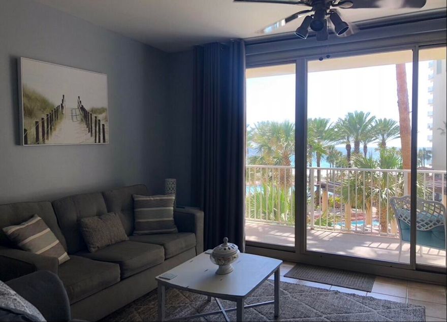 This beautifully decorated, beach-inspired 1BR + bunks Gulf-front condo is rental-ready. Enjoy sweeping views from your third-floor patio overlooking a resort-style pool with tiki huts, zero-entry design, palm trees, and ample lounge space. A private dock provides easy access across white sand to the emerald Gulf waters. Amenities include an indoor pool, spa, fitness center, and secure parking garage. Shores of Panama is undergoing a cosmetic refresh, adding future value. Ideal as an investment, primary residence, or vacation home, and just steps from the pier, dining, and conveniences, this condo has already demonstrated proven rental potential.