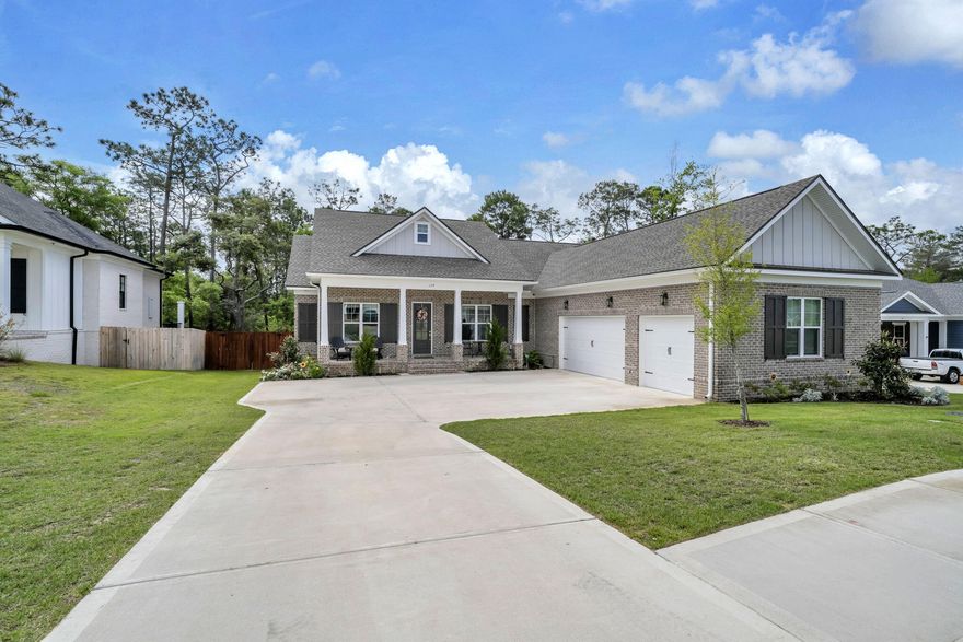 Tucked away on a highly sought-after perimeter lot, this exceptional 4-bedroom, 3-bath home PLUS a dedicated office/flex space offers the perfect blend of privacy, space, and style. Backing to a peaceful walking path and wooded area--and ideally located within the same phase as the community amenities--you'll enjoy both convenience and a serene backdrop.
The spacious lot provides ample room to add a pool, while the full 3-car garage offers versatility for a golf cart, small boat, or additional vehicle. An added bonus: a convenient attic hoist system makes storage a breeze. Inside, the thoughtfully designed open-concept layout features a seamless flow between the kitchen, dining, and living areas--ideal for both everyday living and entertaining. The kitchen and baths showcase quartz countertops, beautifully complemented by brushed gold lighting and plumbing fixtures, while a stylish dry bar in the dining area with floating shelves and a beverage fridge adds an elevated touch.

Throughout the home, you'll find beautifully toned LVP flooring, creating warmth and durability. A generously sized laundry room with a sink and a functional mudroom just off the garage enhance everyday convenience.

This home truly checks all the boxes--space, upgrades, location, and lifestyle.