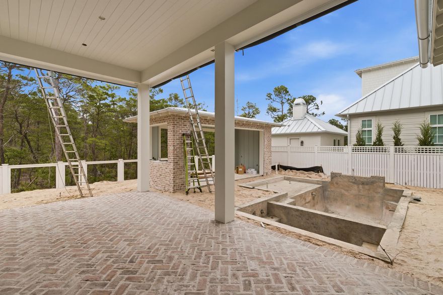 The Evangeline Plan by Key Lime Construction showcases timeless coastal architecture blended with refined modern design, offering 4 bedrooms, 4 full baths, 2 half bathrooms in the main house plus a carriage bedroom with a full bathroom, kitchenette, and flex area over the detached 2-car garage. 

From the moment you enter through the brick-arched foyer, the home welcomes you with soft natural light, engineered hardwood flooring, and an effortless open-concept layout designed for both comfort and sophistication. 

The living room features custom built-ins and a direct-vent brick fireplace, creating an inviting focal point for family and guests.The gourmet kitchen serves as the heart of the home, anchored by dual 10-foot islands, one ideal for daily prep and casual seating, and the other enhanced with both an under-counter beverage refrigerator and a wine cooler. Premium Wolf/Sub-Zero appliances, including a cabinet-panel refrigerator, blend professional performance with polished design. Two separate walk-in pantries (one being a fully equipped butler's pantry styled as a modern-day scullery) offer remarkable functionality, complete with a double- oven, refrigerator, dishwasher, sink, and ample storage. Arched openings lead seamlessly to the dining area and adjoining sitting room, creating an airy sense of connection throughout the home's central living spaces. 

The primary suite on the main level offers a peaceful retreat featuring tray ceilings, a spa-inspired bath with dual vanities, a freestanding soaking tub, a glass-enclosed shower with dual shower heads, and a large custom walk-in closet with built-in wood shelving.

Upstairs, three additional guest suites, each with a walk-in closet, offer private bath access and thoughtfully curated finishes. Tucked away on this level, an expansive media room with a vaulted ceiling provides an inviting retreat for entertainment or relaxation.

A true showstopper, the outdoor living area unfolds as a private, resort-style sanctuaryfeaturing a retractable-screen porch with heirloom brick flooring and a gas fireplace overlooking the saltwater pool with sun shelf and integrated spa. Beyond, a built-in fire pit and brick pavilion with a fully equipped summer kitchencomplete with NatureKast cabinetry, natural gas grill, beverage refrigerator, sink, and covered lounge area create the perfect setting for year-round entertaining. A dedicated pool powder room adds convenience to this exceptional outdoor oasis.

Architectural details such as James Hardie siding, KDAT wood columns, corrugated metal roofing, and brick accents reinforce the home's enduring quality and craftsmanship. With 8-foot solid core doors, quartz countertops throughout, under-cabinet lighting, and custom millwork in every room, the Evangeline Plan embodies coastal luxury at its finest an exceptional offering in the heart of Powell Landing East at Watersound Origins.

Estimated completion: June 2026

Experience refined coastal living in one of Watersound Origins' most sought-after neighborhoods nestled alongside Lake Powell. The Watersound Origins community offers an unparalleled lifestyle in South Walton - exceptional amenities, notoriously friendly and welcoming atmosphere, zero short-term rentals, and close proximity to all that 30A and Inlet Beach has to offer. Enjoy the zero-entry pool, playground, sports courts, and fitness center at the Village Commons, play a round of golf or foot golf at the Origins Golf Course, or take a walk along the many miles of walking and biking trails that wind all throughout the neighborhood!

The new Watersound Town Center located at the entrance to the community offers several fantastic dining options (casual and formal), medical services, Starbucks, Publix, a Pavilion that hosts events year round, and more!