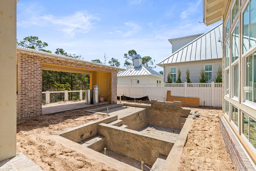 The Evangeline Plan by Key Lime Construction showcases timeless coastal architecture blended with refined modern design, offering 4 bedrooms, 4 full baths, 2 half bathrooms in the main house plus a carriage bedroom with a full bathroom, kitchenette, and flex area over the detached 2-car garage. 

From the moment you enter through the brick-arched foyer, the home welcomes you with soft natural light, engineered hardwood flooring, and an effortless open-concept layout designed for both comfort and sophistication. 

The living room features custom built-ins and a direct-vent brick fireplace, creating an inviting focal point for family and guests.The gourmet kitchen serves as the heart of the home, anchored by dual 10-foot islands, one ideal for daily prep and casual seating, and the other enhanced with both an under-counter beverage refrigerator and a wine cooler. Premium Wolf/Sub-Zero appliances, including a cabinet-panel refrigerator, blend professional performance with polished design. Two separate walk-in pantries (one being a fully equipped butler's pantry styled as a modern-day scullery) offer remarkable functionality, complete with a double- oven, refrigerator, dishwasher, sink, and ample storage. Arched openings lead seamlessly to the dining area and adjoining sitting room, creating an airy sense of connection throughout the home's central living spaces. 

The primary suite on the main level offers a peaceful retreat featuring tray ceilings, a spa-inspired bath with dual vanities, a freestanding soaking tub, a glass-enclosed shower with dual shower heads, and a large custom walk-in closet with built-in wood shelving.

Upstairs, three additional guest suites, each with a walk-in closet, offer private bath access and thoughtfully curated finishes. Tucked away on this level, an expansive media room with a vaulted ceiling provides an inviting retreat for entertainment or relaxation.

A true showstopper, the outdoor living area unfolds as a private, resort-style sanctuaryfeaturing a retractable-screen porch with heirloom brick flooring and a gas fireplace overlooking the saltwater pool with sun shelf and integrated spa. Beyond, a built-in fire pit and brick pavilion with a fully equipped summer kitchencomplete with NatureKast cabinetry, natural gas grill, beverage refrigerator, sink, and covered lounge area create the perfect setting for year-round entertaining. A dedicated pool powder room adds convenience to this exceptional outdoor oasis.

Architectural details such as James Hardie siding, KDAT wood columns, corrugated metal roofing, and brick accents reinforce the home's enduring quality and craftsmanship. With 8-foot solid core doors, quartz countertops throughout, under-cabinet lighting, and custom millwork in every room, the Evangeline Plan embodies coastal luxury at its finest an exceptional offering in the heart of Powell Landing East at Watersound Origins.

Estimated completion: June 2026

Experience refined coastal living in one of Watersound Origins' most sought-after neighborhoods nestled alongside Lake Powell. The Watersound Origins community offers an unparalleled lifestyle in South Walton - exceptional amenities, notoriously friendly and welcoming atmosphere, zero short-term rentals, and close proximity to all that 30A and Inlet Beach has to offer. Enjoy the zero-entry pool, playground, sports courts, and fitness center at the Village Commons, play a round of golf or foot golf at the Origins Golf Course, or take a walk along the many miles of walking and biking trails that wind all throughout the neighborhood!

The new Watersound Town Center located at the entrance to the community offers several fantastic dining options (casual and formal), medical services, Starbucks, Publix, a Pavilion that hosts events year round, and more!