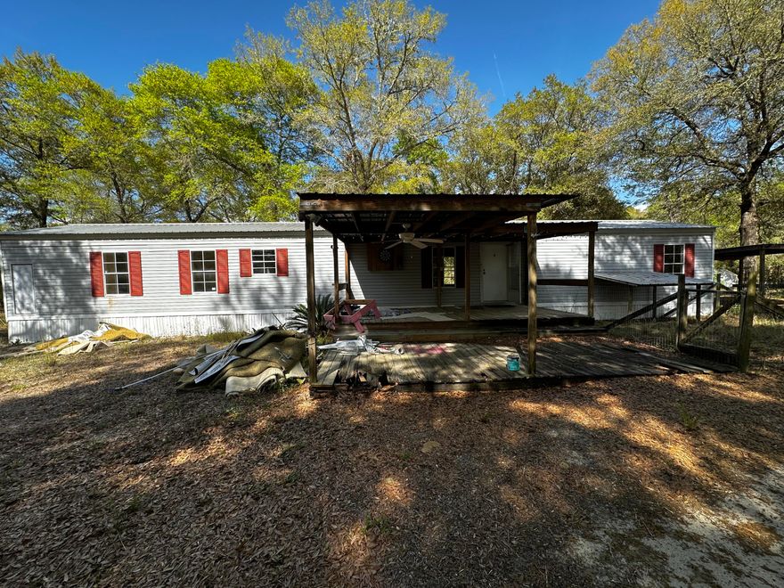 Situated on a level one-acre lot with direct access to Highway 393, this property offers a fantastic opportunity for those looking to build sweat equity. The existing mobile home features a functional layout and holds great potential for a full renovation to suit your personal style or to serve as a high-value rental. Its location in North Crestview provides a peaceful, rural feel while maintaining a quick commute to local shopping and dining.

The property is being sold in its current as-is condition with no repairs or warranties provided. This is a versatile option for anyone ready to take on a project and add immediate value to a home on a generous piece of land.