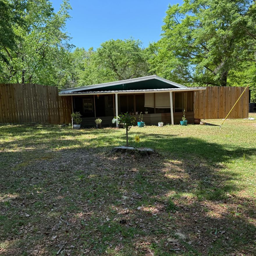 Discover the perfect blend of privacy, convenience, and country charm with this beautifully maintained homestead nestled on 1.2 acres in Walton County, south of I-10. Surrounded by nature yet ideally located, this property offers easy access to everyday essentials and local attractions--just 15 minutes to DeFuniak Springs, 20 minutes to Freeport, 20 minutes to Morrison Springs, and only 35 minutes to the stunning Emerald Coast beaches.


This move-in ready 2-bedroom, 1.5-bath home is built on a solid slab foundation and features a thoughtfully landscaped setting with a peaceful, wooded backdrop. The fully fenced, park-like backyard is a true highlight, complete with satsuma and fig trees, as well as blueberry and blackberry bushes--perfect for enjoying your own private oasis. The home includes all appliances, and conveys fully furnished, making this an exceptional turnkey opportunity. In addition, everything needed to maintain the property is included--such as a 42" Husqvarna riding mower, a push mower, miscellaneous tools, and even fertilizer for the fruit and palm trees.

Additional features include a 50-foot pole installed for reliable, high-speed internet at an affordable $50/month, a deep private well, and septic system--keeping utility costs impressively low. The property also offers three storage sheds and a lean-to, providing ample space for tools, equipment, and recreational items.

For guests, a convenient 30-amp electrical hookup is located at the front of the property--ideal for RV or camper use. Enjoy peaceful mornings or relaxing evenings on the spacious screened porch, the perfect spot to take in the surrounding natural beauty.

Closing available after July 12th.

Contact the listing agent for details on available buyer incentives.