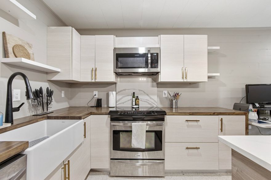 Stunning mid-century studio that has just become available in the heart of downtown. This charming 810 sq. ft. studio boasts new appliances, including a washer and dryer, and features beautiful new cabinets with butcher block countertops. The terrazzo and tile floors add a touch of elegance, while the tile shower offers a modern feel. You'll also enjoy a back patio and a partially fenced yard, perfect for relaxing or entertaining. Located close to the lake and a variety of restaurants, this property offers the perfect blend of convenience and style.