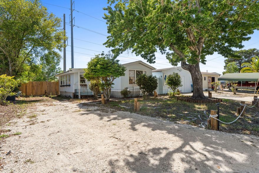 Welcome home! This home offers comfort and great outdoor living - all less than 10 minutes from Pier Park and the beach! The home is already registered as real property, and includes all furnishings! A roof and water heater replaced in 2022 gives peace of mind. Inside, you'll find stainless steel appliances and LVP flooring. Step out back and the property really shines! Enjoy a fully fenced yard, a spacious back deck, and an above-ground saltwater pool - perfect for relaxing or entertaining. The outdoor shower and bar area make it easy to rinse off and unwind. A detached garage and storage shed provide plenty of room for tools, toys, or hobby space. Whether you're looking for a primary residence, beach getaway, or investment opportunity, this property checks all the boxes!