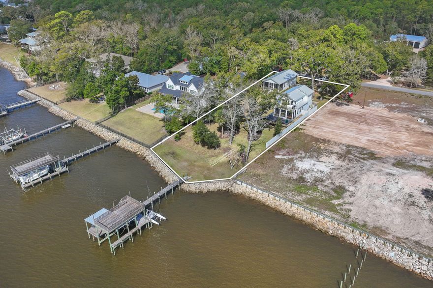An exceptional bayfront retreat offering private dockage, sweeping sunset views, and the freedom of no HOA--an increasingly rare combination along the Emerald Coast.

Positioned along the North Shore of Choctawhatchee Bay, 315 RED BARN RD offers 100' of shoreline, and presents a refined waterfront setting defined by panoramic water views and effortless coastal living. This custom-built residence blends understated elegance with modern construction, creating a private sanctuary, this Bayfront oasis is just moments from the beaches, dining, and conveniences of the 30A corridor. Both the cottage house constructed in 2021, and garage with carriage house built just a few years ago, have been meticulously maintained in exceptional, like-new condition. The construction reflects a commitment to quality and durability, featuring hurricane-rated doors and windows along with a Generac whole-home backup generator with automatic transfer switch for uninterrupted comfort and peace of mind.

The homesite is thoughtfully positioned to capture both privacy and expansive water views, while a 10 x 16 garden shed equipped with an electric panel offers flexibility for future enhancements, including a spa or outdoor living addition. 

Plans are available to expand the existing residence, presenting a unique opportunity to further curate and elevate the property into a bespoke waterfront estate.

Enhancing the waterfront lifestyle, the property includes a private dock with three lifts: a boat lift, a sailboat catamaran lift, and a jet ski lift, allowing for immediate access to the bay, Crab Island, and the Gulf beyond. 

Further distinguishing the property, it is not located within an HOA and is situated in Flood Zone X, meaning no flood insurance is required. 

Set within one of Florida's most dynamic and rapidly growing coastal areas, this offering represents a compelling blend of lifestyle, exclusivity, and long-term value.