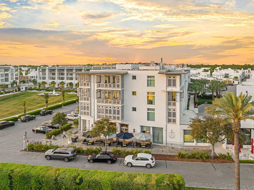 Positioned on the prominent southeast corner of the Alys Beach Town Center, Residence 303 at The May represents a rare offering within one of 30A's most architecturally disciplined and sought-after communities. One of just eight residences within this boutique, four-story condominium, the home occupies a premier third-floor position, wrapping three sides of the building and capturing layered views that define Alys Beach living. The two-bedroom residence is designed with a deliberate emphasis on indoor-outdoor continuity. Expansive bi-fold doors open from the main living, dining, and kitchen spaces onto a 21-foot-wide shuttered balcony, framing westerly views over the Alys Beach Amphitheatre and the iconic stretch of Scenic Highway 30A. A second balcony, accessed from both the primary suite and guest bedroom, captures the softness of morning light with eastern exposures, while a third, 16-foot-wide terrace extends southward, offering glimpses toward the Gulf of Mexico.

Inside, the material palette reflects Alys Beach's signature restraint and refinement. Venetian plaster is carried floor to ceiling throughout the main living areas and hallways, creating a seamless sense of texture and depth. A soft coastal marble backsplash, custom cabinetry, and refined tilework in each bathroom reinforce the home's elevated, cohesive design language. The professional-grade kitchen, appointed with Wolf and Sub-Zero appliances, anchors the main living space with both function and quiet sophistication. The residence is offered with thoughtfully curated furnishings, delivering a complete, turnkey experience.

What distinguishes Residence 303 is not only its orientation, spanning east, west, and south exposures, but its ability to fully engage with the rhythm of the town center below. Palm-lined avenues, curated retail, and the architectural symmetry of Alys Beach become part of the daily backdrop, viewed from a series of covered outdoor rooms that extend the living experience well beyond the interior walls.

Life at Alys Beach extends beyond the walls. Deeded beach access places the Gulf within easy reach, while Alys Beach's curated amenities; pools, tennis courts, fitness facilities, and landscaped pedestrian paths; create a walkable environment designed as carefully as the homes themselves.

This is a residence that lives as both a private retreat and a front-row vantage point to one of the most refined coastal environments along 30A.