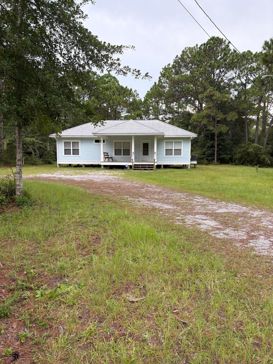 Charming original-owner single-family home, located in the heart of Santa Rosa Beach on 2.293 acres consisting of 8 platted lots of record. No HOA. This 3BR/2BA home incorporates the open concept living, kitchen, & dining areas with large, covered front and rear porches.  Located just minutes from Cessna Landing, white sand beaches, restaurants, & shopping.  Discover the perfect blend of location & value. Great opportunity for builder/developer or investor.
