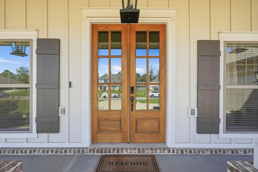 Nestled in Whitley Estates, a well maintained community in the heart of Pace, this home offers a low HOA and convenient access to beaches, shopping, dining, medical facilities, and NAS Whiting Field.

From the moment you step through the custom double mahogany front doors, it is clear that 6297 Howie Way is something special. Meticulously maintained and thoughtfully designed, this 2,540 sq ft, 4 bedroom, 3 bath home with a flex room blends elevated finishes with the warm, unhurried lifestyle that makes Pace one of Northwest Florida's most desirable communities.

The open floor plan feels expansive from the start, anchored by 10 foot ceilings in the living and dining areas and continuous EVP flooring that flows seamlessly through the main living spaces and primary suite. Smooth textured walls, custom window and door casings, two piece and crown molding add architectural character well beyond builder grade. A 42-inch gas fireplace serves as a warm, inviting focal point, while the open-concept living areas keep the cook connected and part of the conversation.

The kitchen is equally suited for everyday living and entertaining. It features Samsung appliances, including a split gas cooktop, Energy Star dishwasher, built in microwave, and wall oven for true double oven convenience. A spacious walk in pantry offers abundant storage, while soft close cabinetry, granite countertops, under cabinet lighting, and a subway tile backsplash bring both style and function together. The oversized island with quartz countertops is perfect for gatherings, and a cozy breakfast nook completes the space.

The primary suite is a true retreat, highlighted by tray ceilings in both the bedroom and en suite bath. The bathroom features a large tiled shower with frameless glass, a separate soaking tub with tiled surround, and dual vanities, each paired with its own walk in closet, creating a space designed for both comfort and ease.

A split floor plan places the secondary bedrooms away from the primary suite, offering privacy for guests, family, or a dedicated home office. Everyday functionality continues with a built in mud bench off the garage entry and a laundry room with utility sink.

Situated on a generous half acre lot, the outdoor space is just as impressive. A screened back porch with a beautifully stained V groove pine ceiling, echoed on the front porch, creates the perfect place to relax. The fully privacy fenced backyard offers endless possibilities, whether you envision a pool, garden, or play space. Additional exterior features include LED recessed lighting in the front eaves, custom shutters, Low E windows for energy efficiency, irrigation system, ridge vents, and a hip roof.

Meticulously maintained and loaded with signature level upgrades, 6297 Howie Way is a rare opportunity to own a truly elevated home in one of Pace's most sought after communities.

Schedule your private showing today.