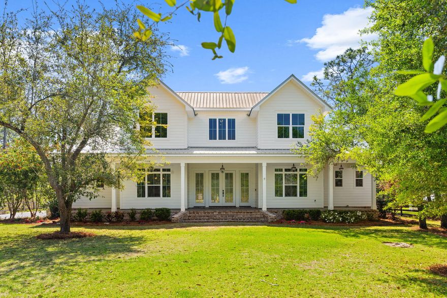 Welcome to your own private piece of waterfront paradise on beautiful Churchill Bayou...where life slows down, the views stretch wide, & every detail feels just right. Nestled on 1.38 gated & fenced acres, this custom-built home (completed in 2021 and only 3.8 miles to 30A) offers a rare blend of space, comfort, and quiet luxury in an area where neighboring homes reach well over $4 million. With a three-car garage, irrigation system, & room to truly spread out, this property was designed for both everyday ease & gracious entertaining.  Surrounded by nature, privacy, & the kind of peaceful setting that's getting harder to find.  Inside, the home welcomes you with warmth and thoughtful design. Custom finishes are carried throughout, from the countertops & lighting to the mirrors and details that tie it all together. The kitchen features marble countertops, a charming brick backsplash, a gas stove, and a truly impressive walk-in pantry. A tankless water heater adds efficiency and convenience.  The wine bar is complete with a ice maker, perfect for evening sunset boat rides. The main level offers a private office with glass French doors, a guest bedroom with en-suite bathroom, a large laundry room, and a primary suite that feels like a retreat of its own...complete with custom closets and a spa-style shower with a rain head, dual showerheads, and body sprays.  The primary bedroom has french doors that led to the outdoor pool.  Upstairs, you'll find even more room to live and gather, with a second laundry area and two oversized bonus spaces (perfect for a media room, bedroom, playroom, or whatever fits your lifestyle) bringing the total living space to nearly 3,500 square feet.  The enclosed in-ground pool and hot tub overlook the bayou.  A convenient bathroom located just off the pool area makes outdoor living even more comfortable for guests and gatherings. The private dock with boat lift makes it easy to spend your days on the water. With plenty of land still to work with, there's even room to add a carriage house or guest quarters down the road...giving you flexibility for the future. And perhaps the best part...there's no active HOA, offering a level of freedom and tranquility that's hard to come by. Why wait to build when you can step into your dream home today?