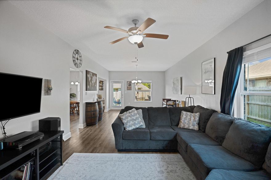 Welcome to this well-maintained two-story home with 3 bedrooms and 2.5 bathrooms in the highly sought-after Seagrass Point Subdivision. The kitchen features stainless steel appliances, hard surface countertops, dark wood cabinetry, bar-height seating, and an eat-in area. Luxury vinyl plank flooring runs throughout the main living spaces with no carpet downstairs. Upstairs offers all bedrooms plus a versatile bonus area. The primary suite includes a trey ceiling, double vanities, walk-in closet, and tub/shower combo. Enjoy a fully fenced backyard with patio, plus LED lighting, hurricane shutters, and a finished garage. Convenient to NAS Pensacola, shopping, and dining. Buyer to verify all information.